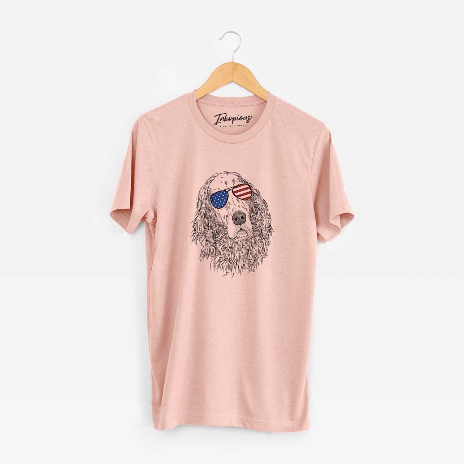 Hand-drawn sketch of Dexter the English Setter wearing American flag sunglasses on a Peach Unisex crewneck