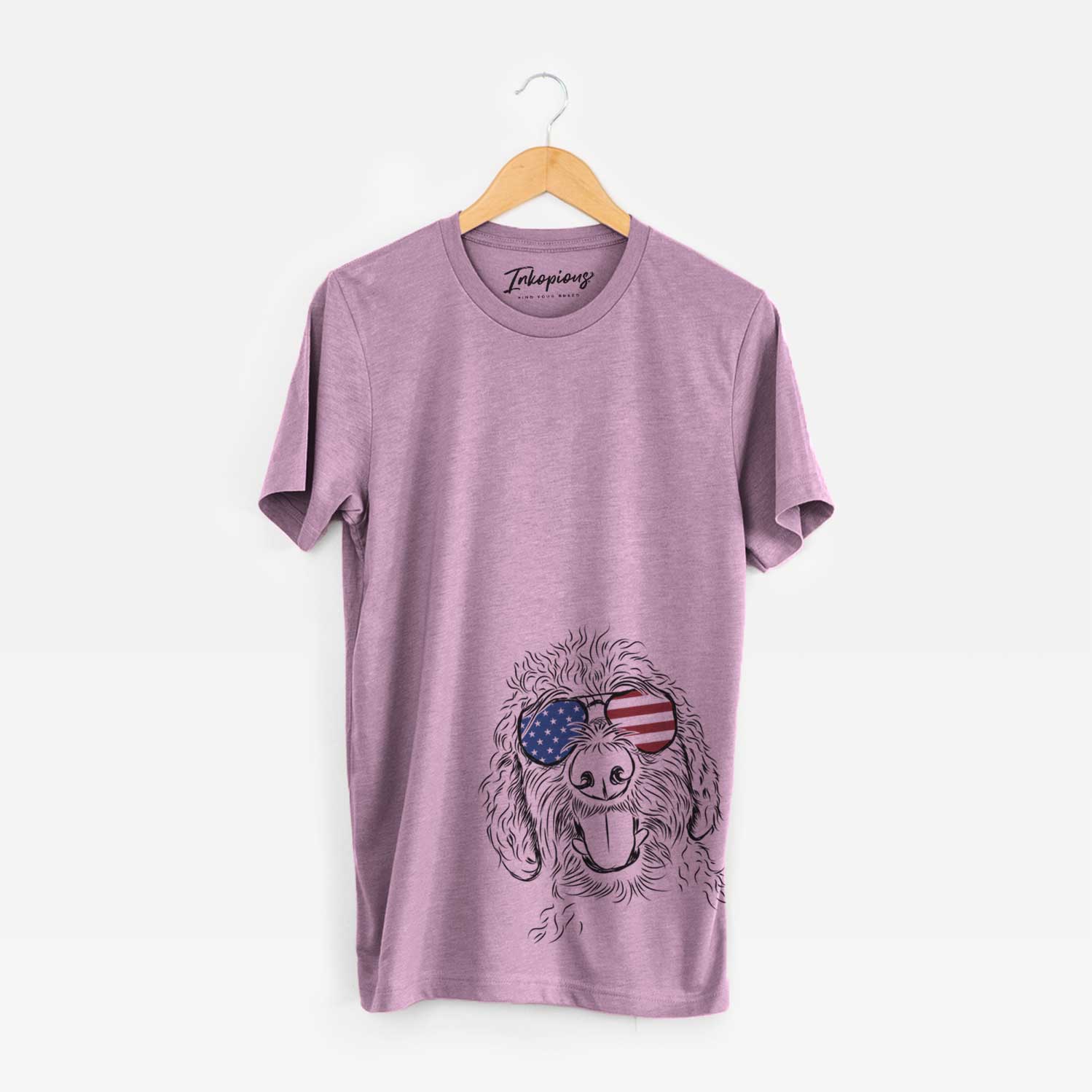 Hand-drawn sketch of Dixie the Doodle wearing American flag sunglasses on an Orchid Unisex crewneck