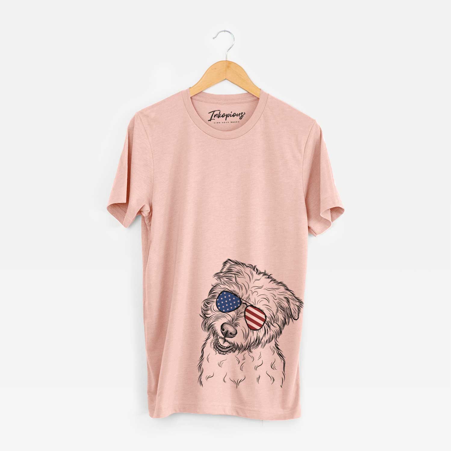 Hand-drawn sketch of Duffy the Glen of Imaal Terrier wearing American flag sunglasses on a Peach Unisex crewneck