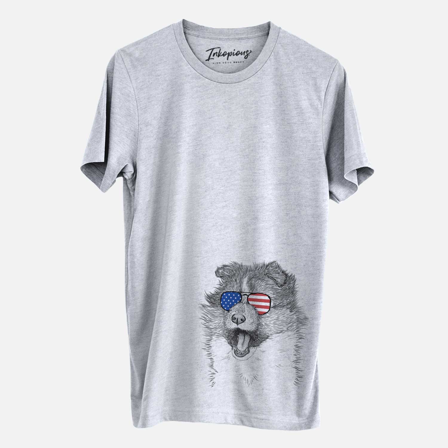 Hand-drawn sketch of Dylan the Shetland Sheepdog wearing American flag sunglasses on a Grey Unisex crewneck