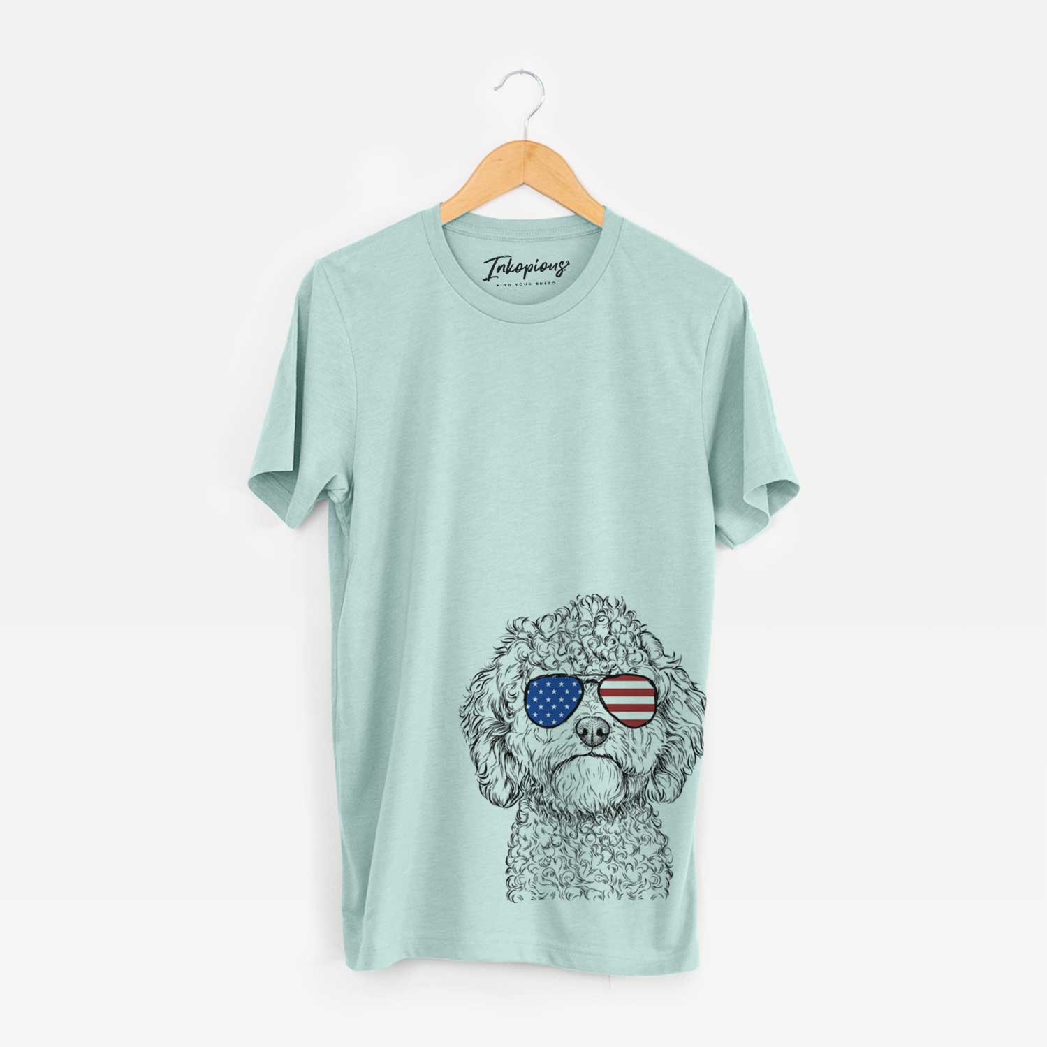 Hand-drawn sketch of Edgar the Shihpoo wearing American flag sunglasses on a Heather Sage Unisex crewneck