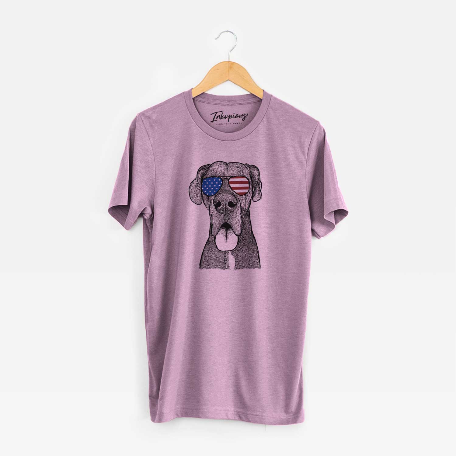 Hand-drawn sketch of Eli the Great Dane wearing American flag sunglasses on an Orchid Unisex crewneck