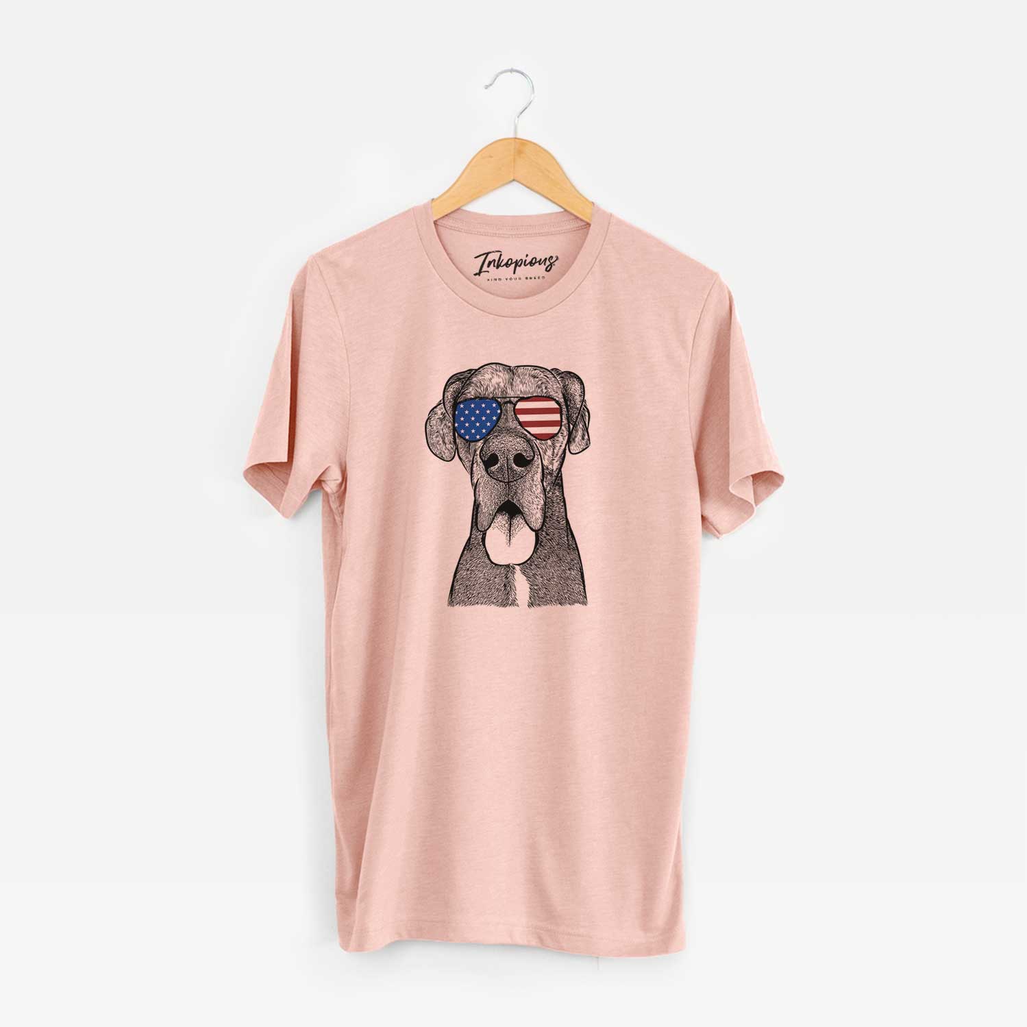 Hand-drawn sketch of Eli the Great Dane wearing American flag sunglasses on a Peach Unisex crewneck
