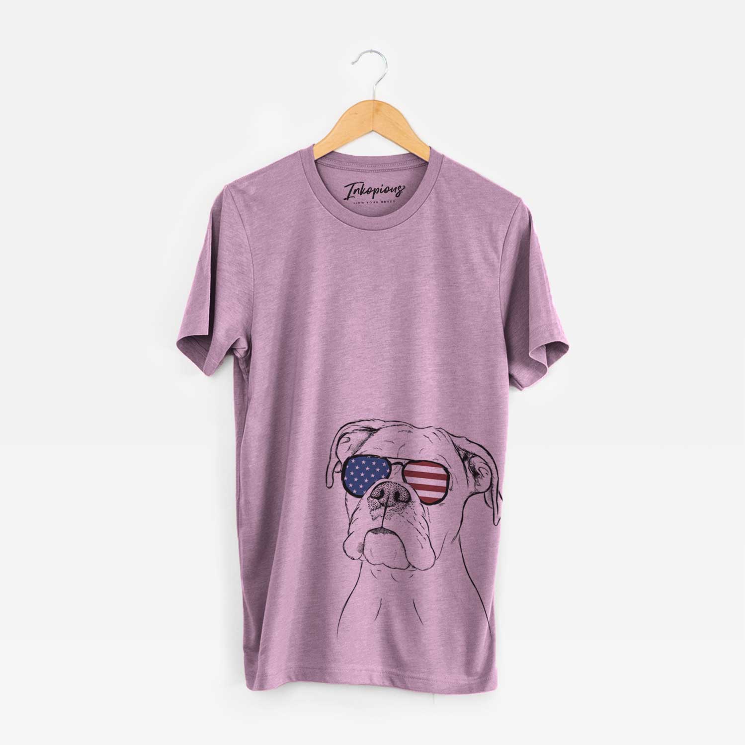 Hand-drawn sketch of Ellie the Boxer wearing American flag sunglasses on an Orchid Unisex crewneck