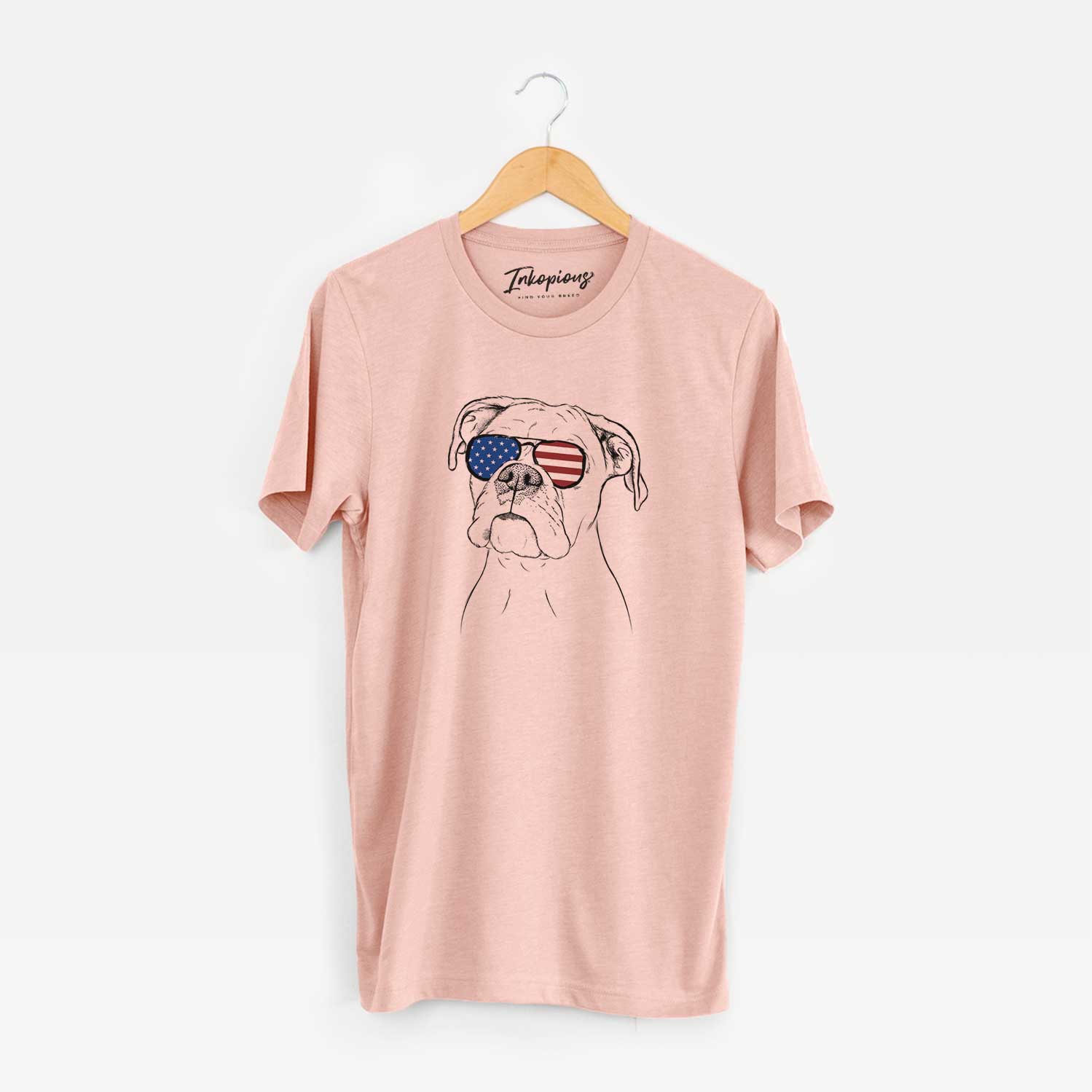 Hand-drawn sketch of Ellie the Boxer wearing American flag sunglasses on a Peach Unisex crewneck