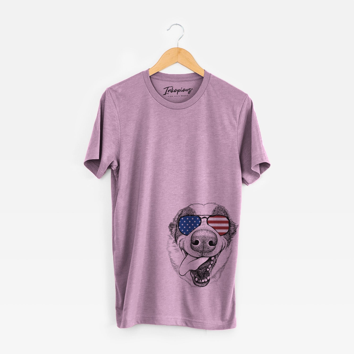 Hand-drawn sketch of Elwood the Border Collie wearing American flag sunglasses on an Orchid Unisex crewneck