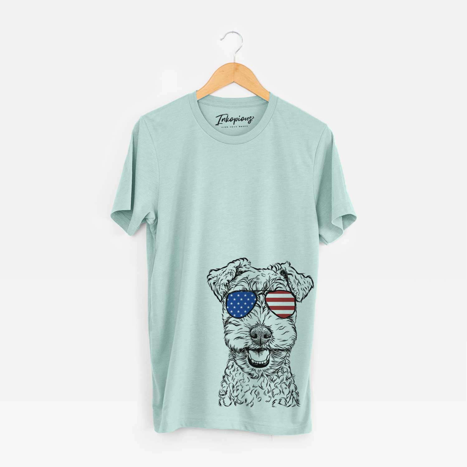 Hand-drawn sketch of Fintan the Irish Troodle wearing American flag sunglasses on a Heather Sage Unisex crewneck