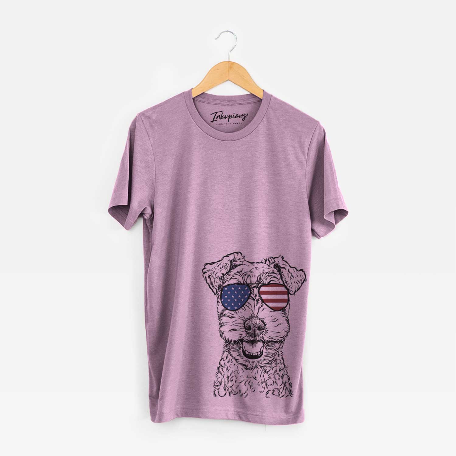 Hand-drawn sketch of Fintan the Irish Troodle wearing American flag sunglasses on an Orchid Unisex crewneck