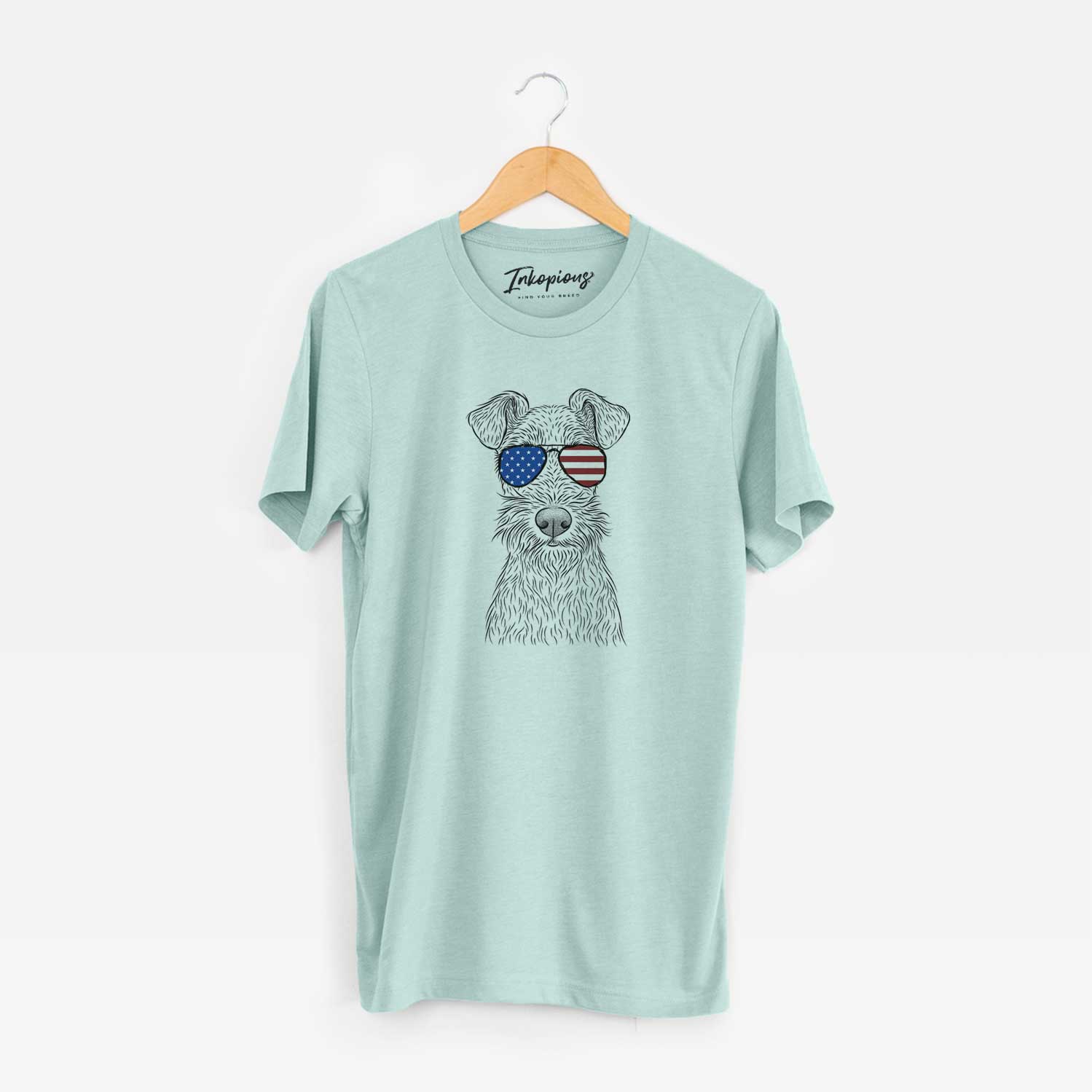 Hand-drawn sketch of Fitz the Wire Fox Terrier wearing American flag sunglasses on a Heather Sage Unisex crewneck