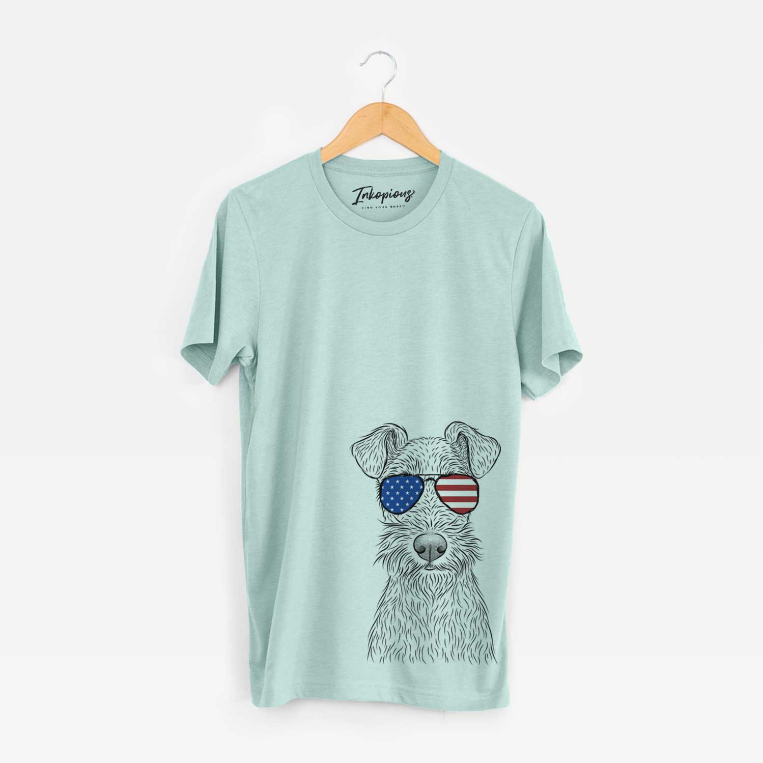 Hand-drawn sketch of Fitz the Wire Fox Terrier wearing American flag sunglasses on a Heather Sage Unisex crewneck