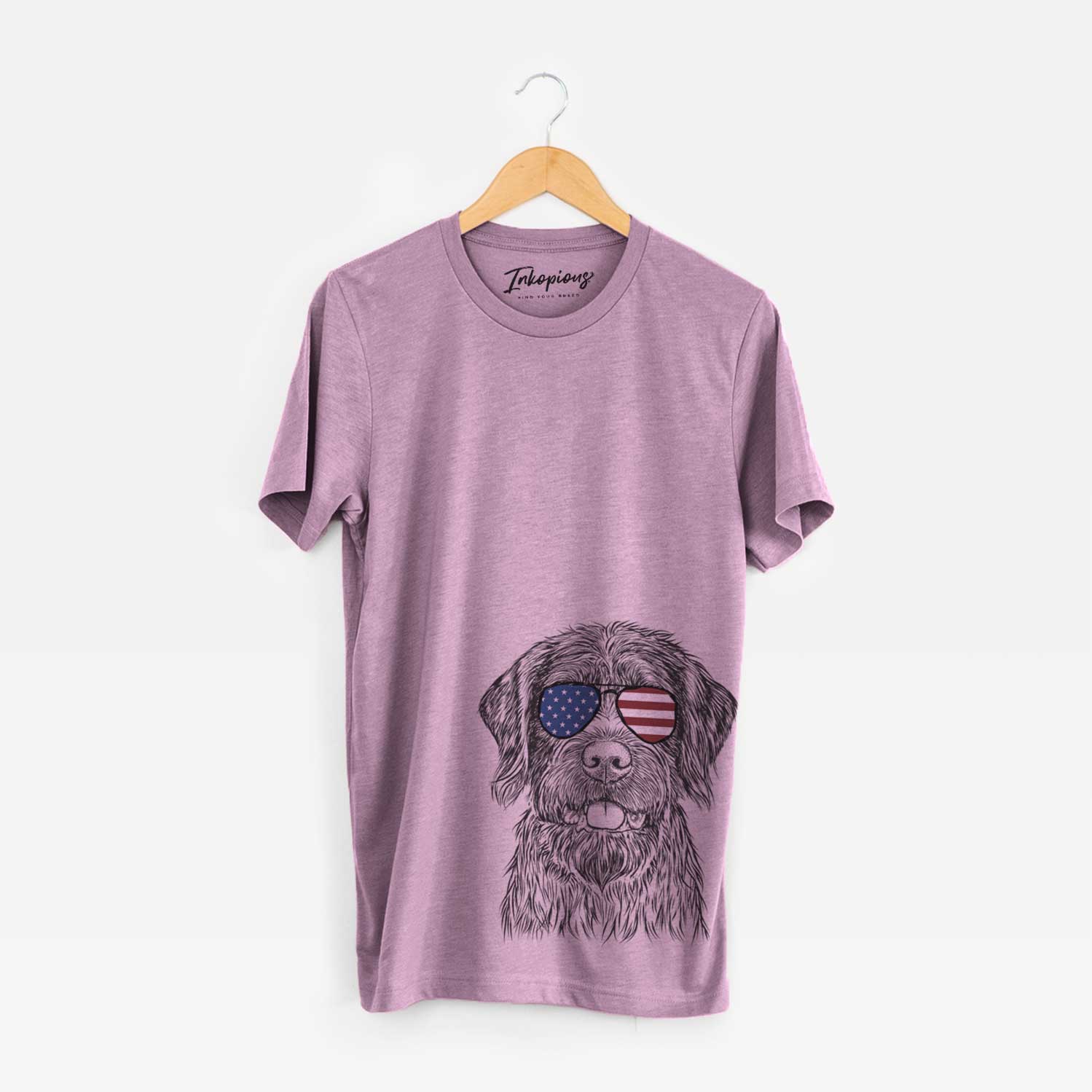 Hand-drawn sketch of Fletcher the Wirehaired Pointing Griffon wearing American flag sunglasses on an Orchid Unisex crewneck