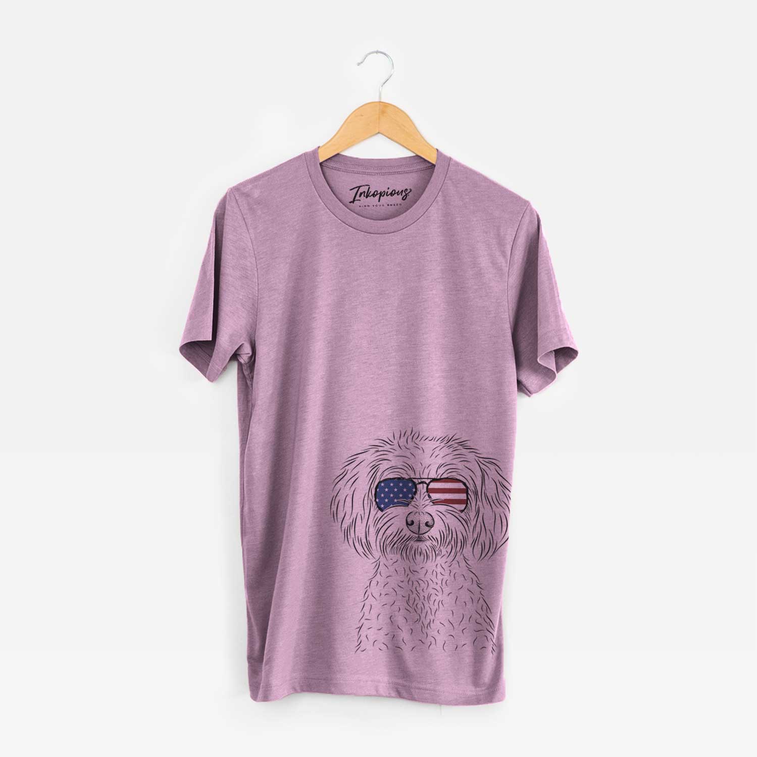 Hand-drawn sketch of Francesca the Maltipoo wearing American flag sunglasses on an Orchid Unisex crewneck