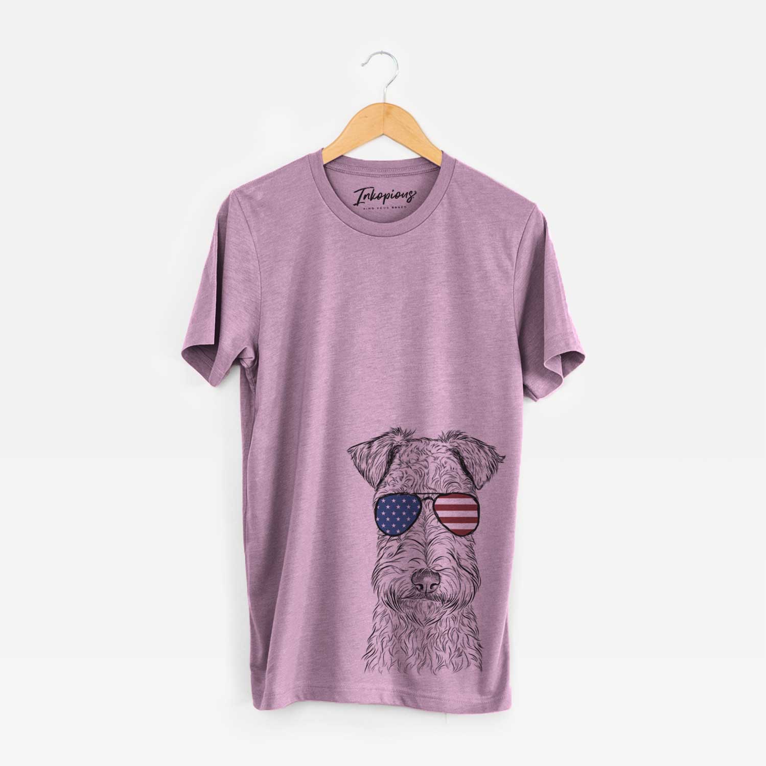 Hand-drawn sketch of Frida the Lakeland Terrier wearing American flag sunglasses on an Orchid Unisex crewneck