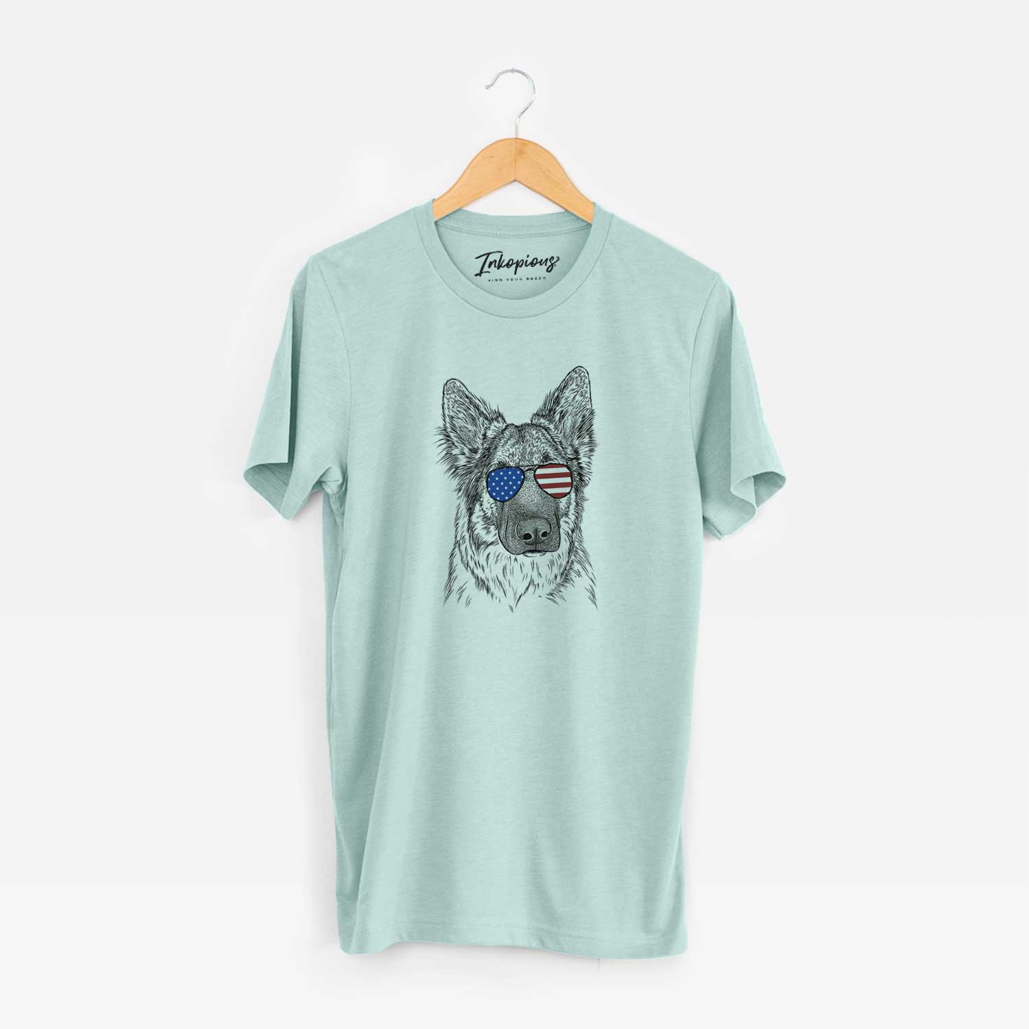Hand-drawn sketch of Geddy the Shiloh Shepherd wearing American flag sunglasses on a Heather Sage Unisex crewneck