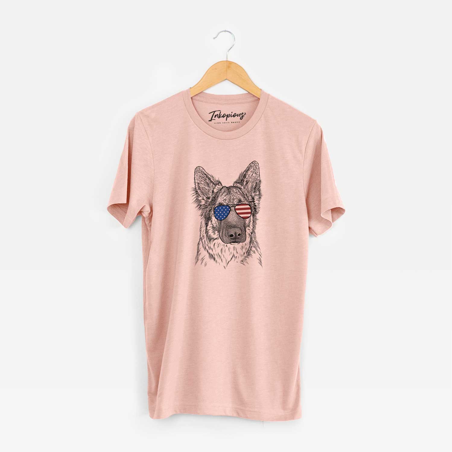 Hand-drawn sketch of Geddy the Shiloh Shepherd wearing American flag sunglasses on a Peach Unisex crewneck