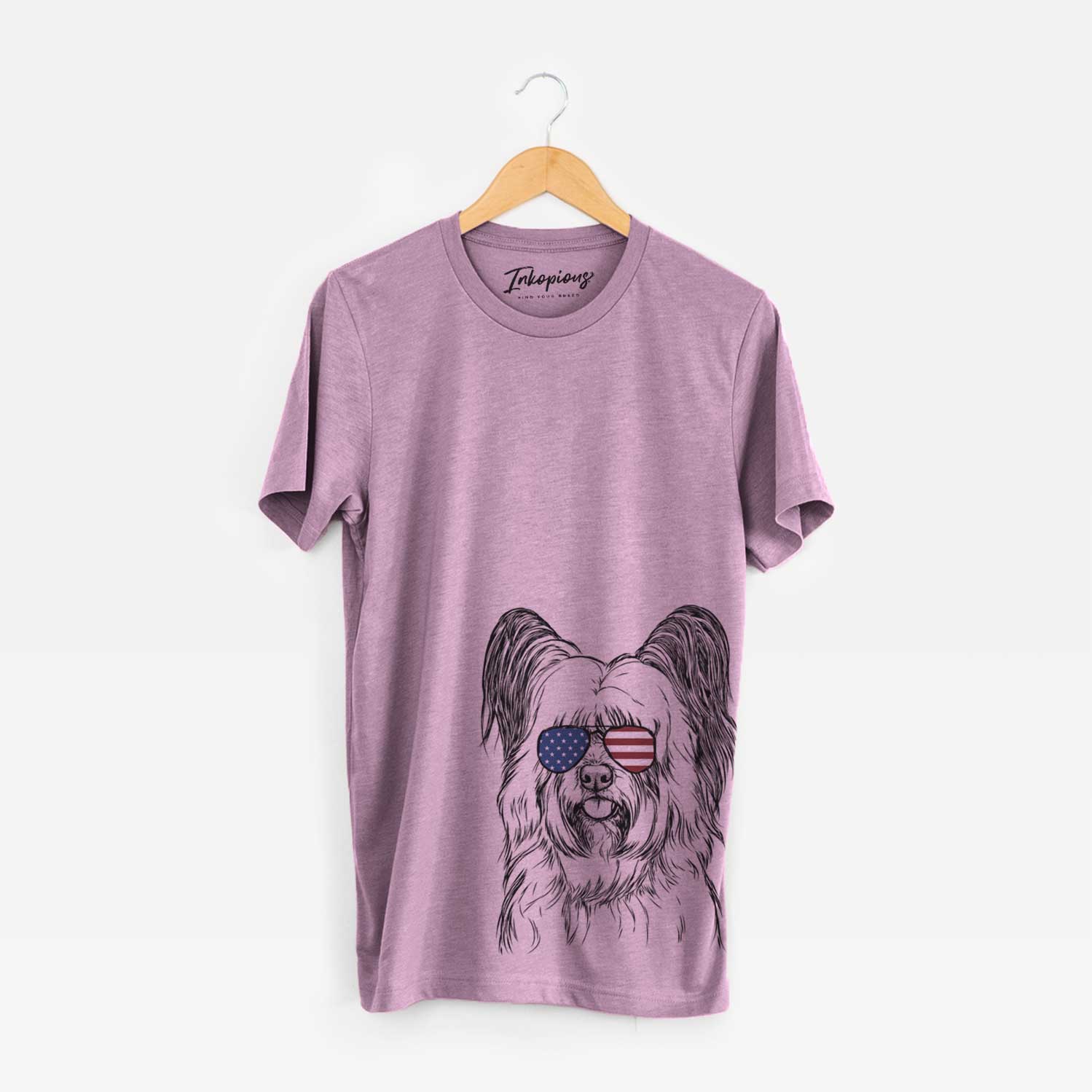 Hand-drawn sketch of Gideon the Skye Terrier wearing American flag sunglasses on an Orchid Unisex crewneck