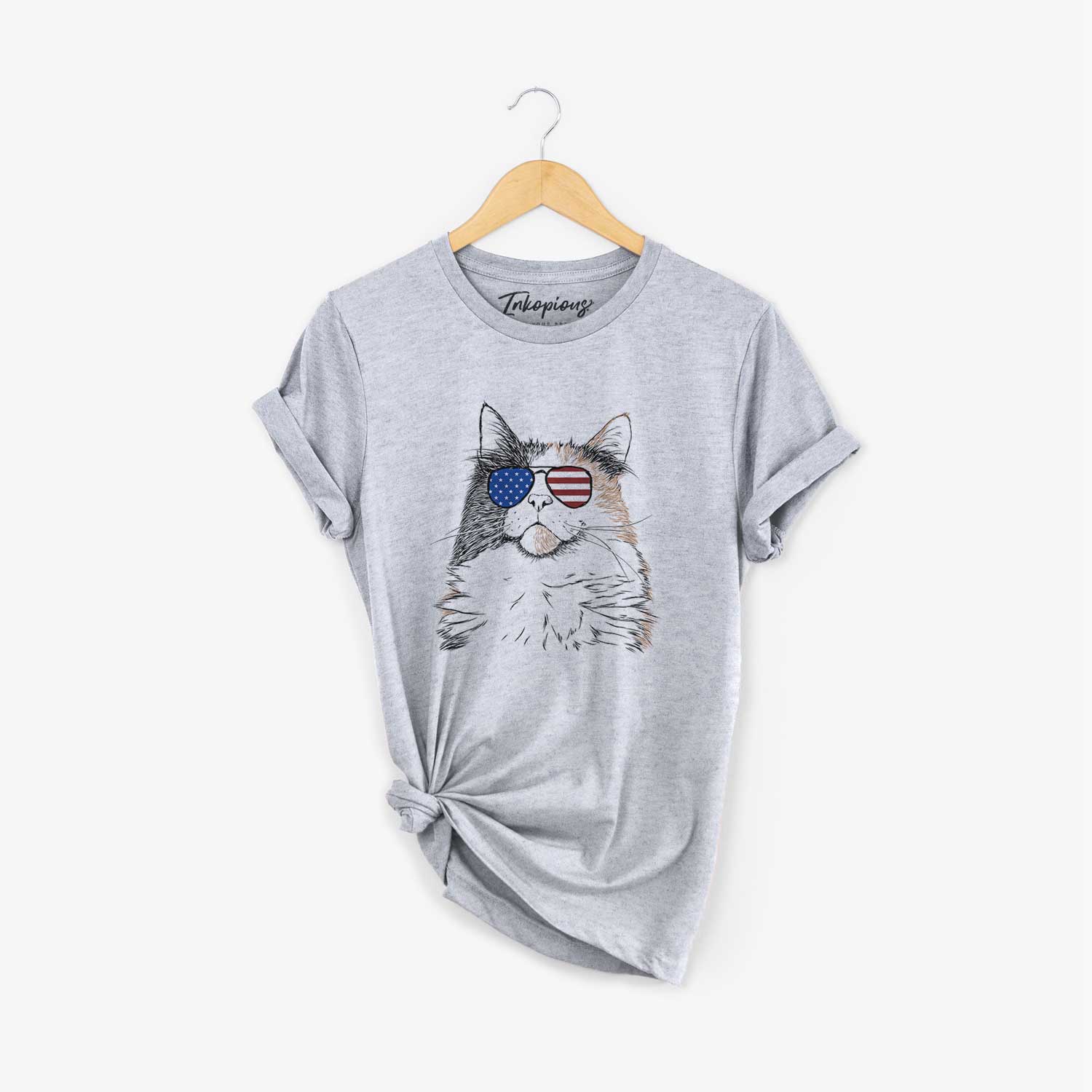 Hand-drawn sketch of Greta the Calico Cat wearing American flag sunglasses on a Grey Unisex crewneck