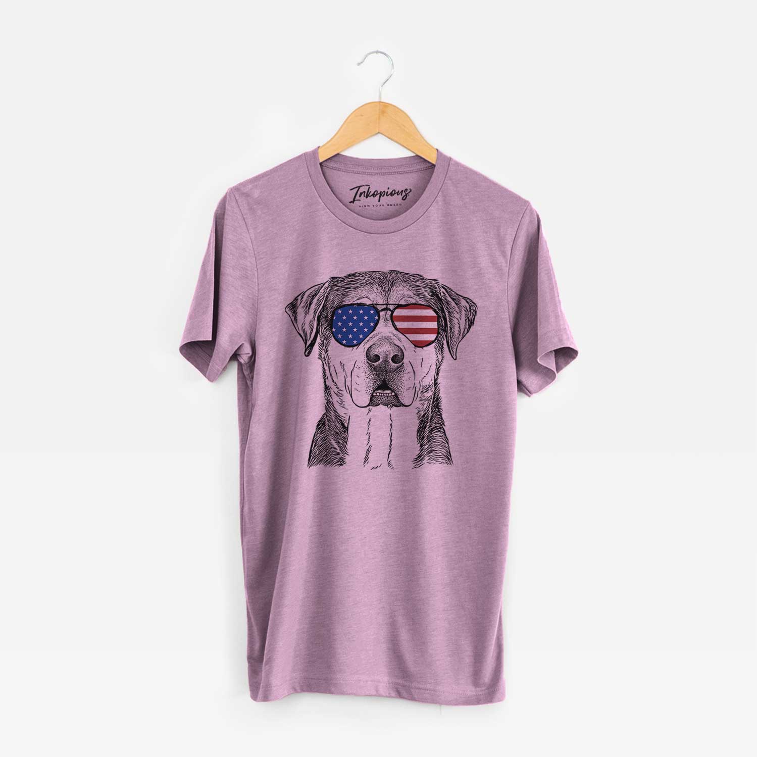 Hand-drawn sketch of Gus the Rottweiler Mix wearing American flag sunglasses on an Orchid Unisex crewneck
