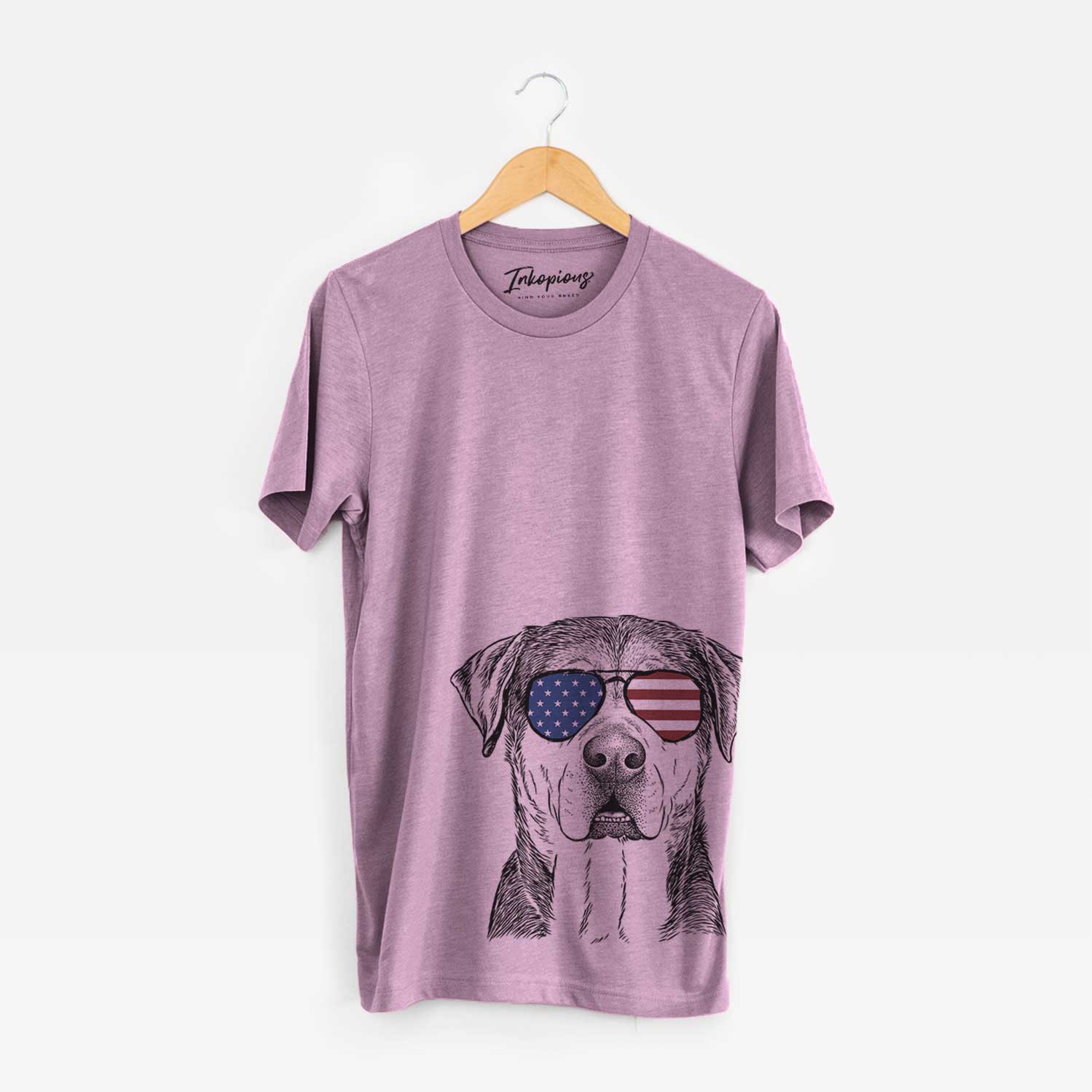 Hand-drawn sketch of Gus the Rottweiler Mix wearing American flag sunglasses on an Orchid Unisex crewneck