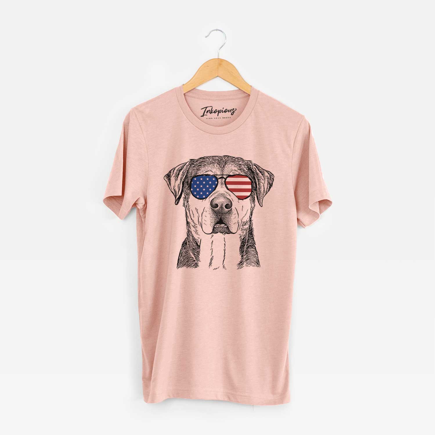Hand-drawn sketch of Gus the Rottweiler Mix wearing American flag sunglasses on a Peach Unisex crewneck