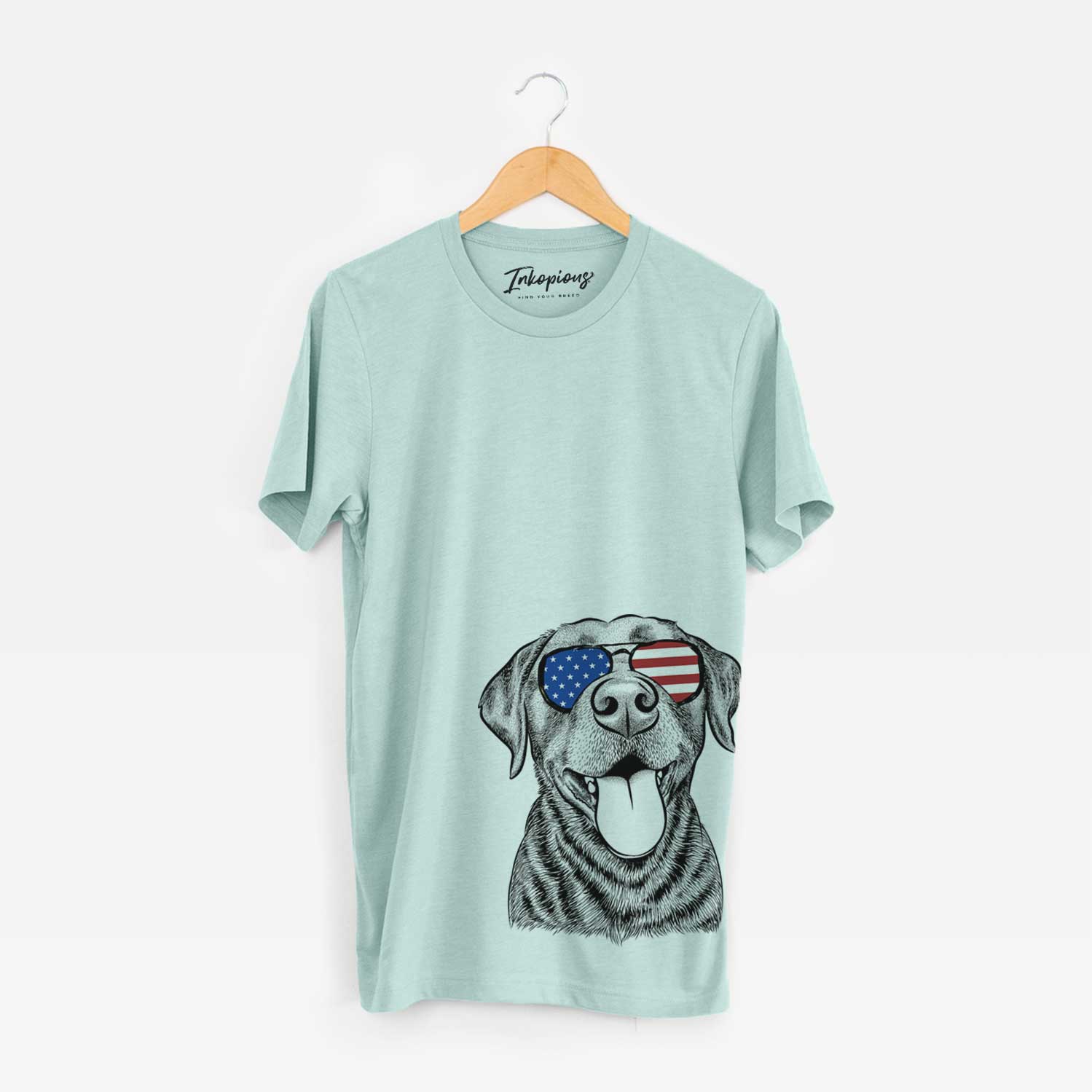 Hand-drawn sketch of Gwen the Labrador Retriever wearing American flag sunglasses on a Heather Sage Unisex crewneck
