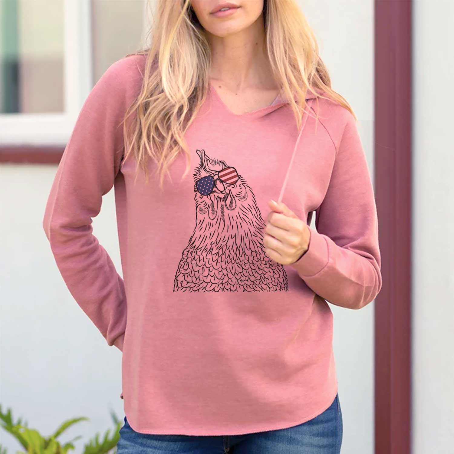 Hand-drawn sketch of Henrietta the Chicken wearing American flag sunglasses on a Dusty Rose Cali Wave Hooded Sweatshirt, lifestyle photo