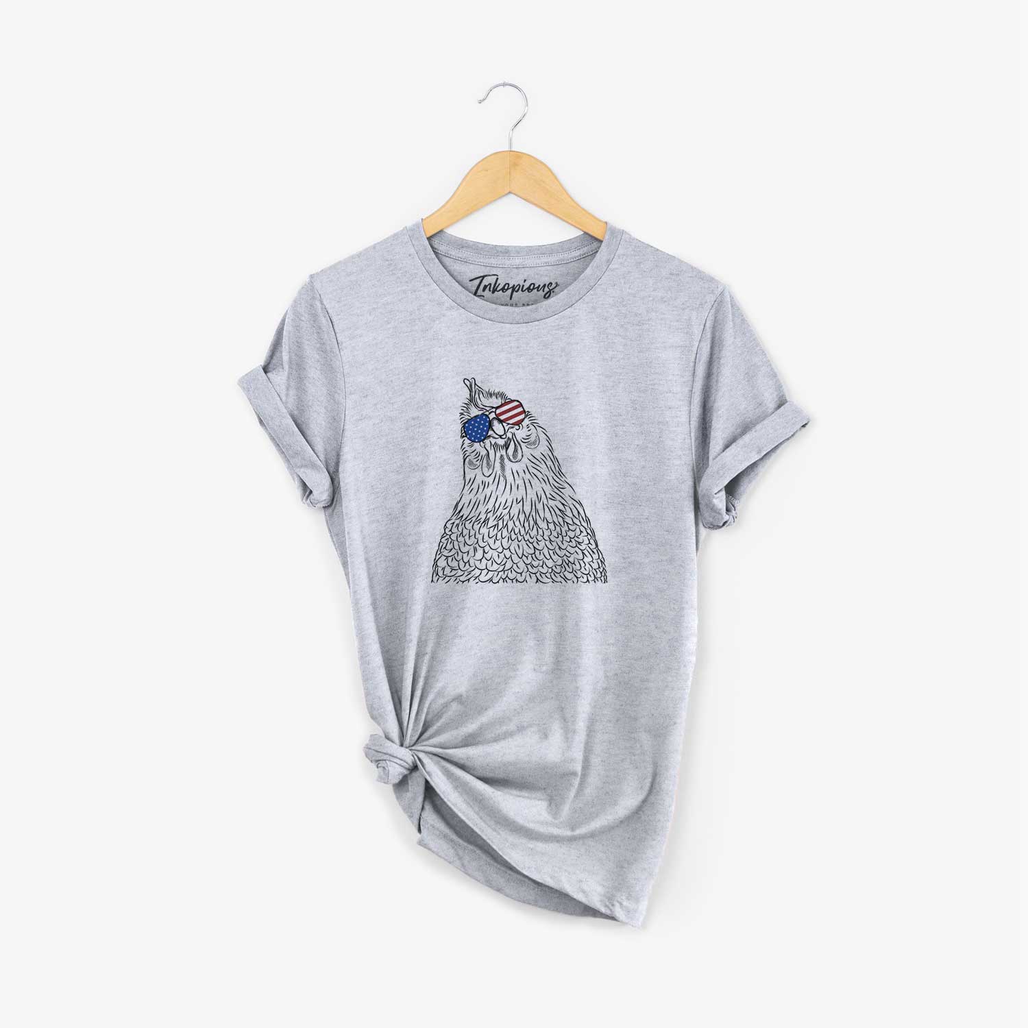 Hand-drawn sketch of Henrietta the Chicken wearing American flag sunglasses on a Grey Unisex crewneck