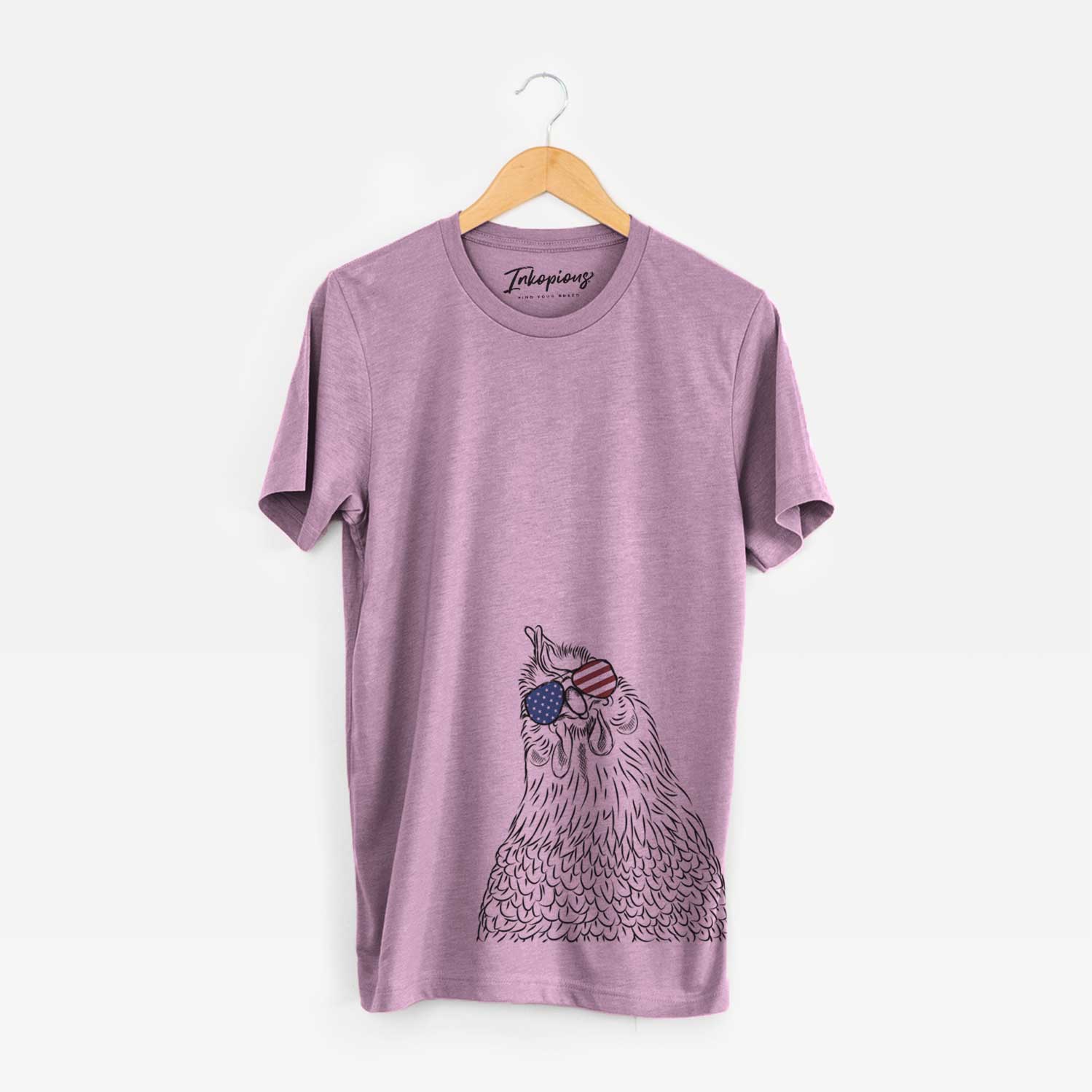 Hand-drawn sketch of Henrietta the Chicken wearing American flag sunglasses on an Orchid Unisex crewneck