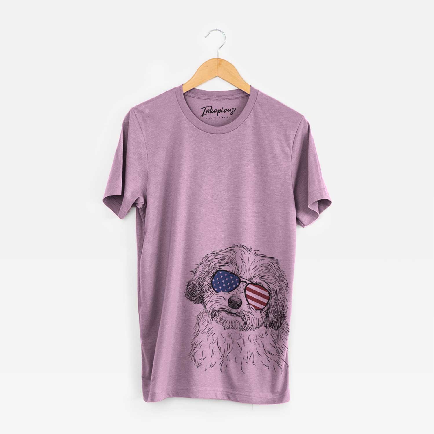 Hand-drawn sketch of Henry the Havanese wearing American flag sunglasses on an Orchid Unisex crewneck