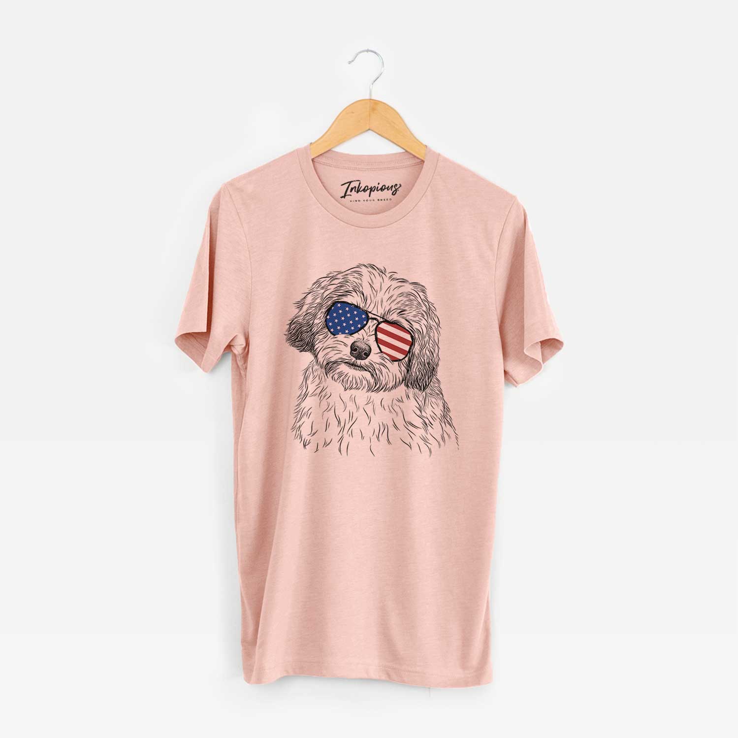 Hand-drawn sketch of Henry the Havanese wearing American flag sunglasses on a Peach Unisex crewneck