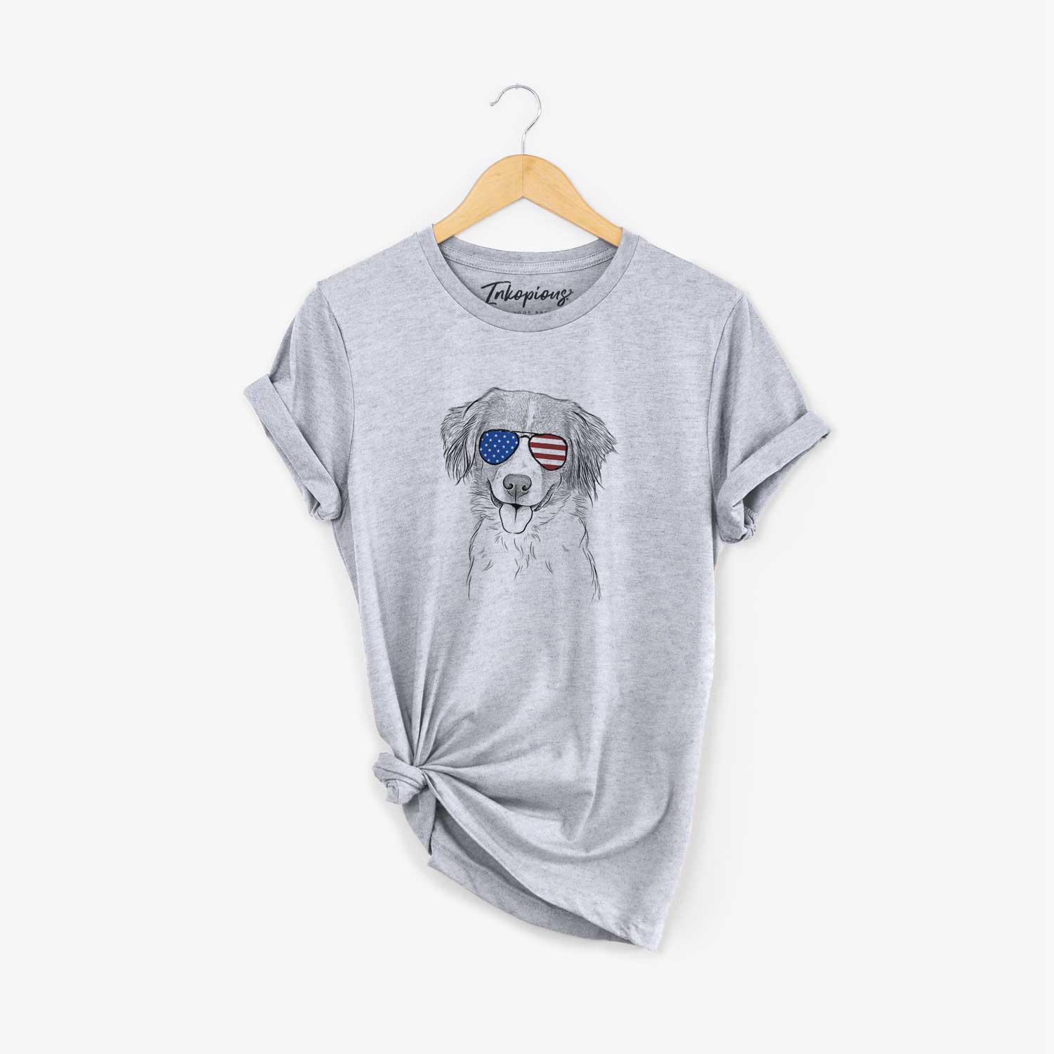 Hand-drawn sketch of Hercules the Nederlandse Kooikerhondje wearing American flag sunglasses on a Grey Unisex crewneck