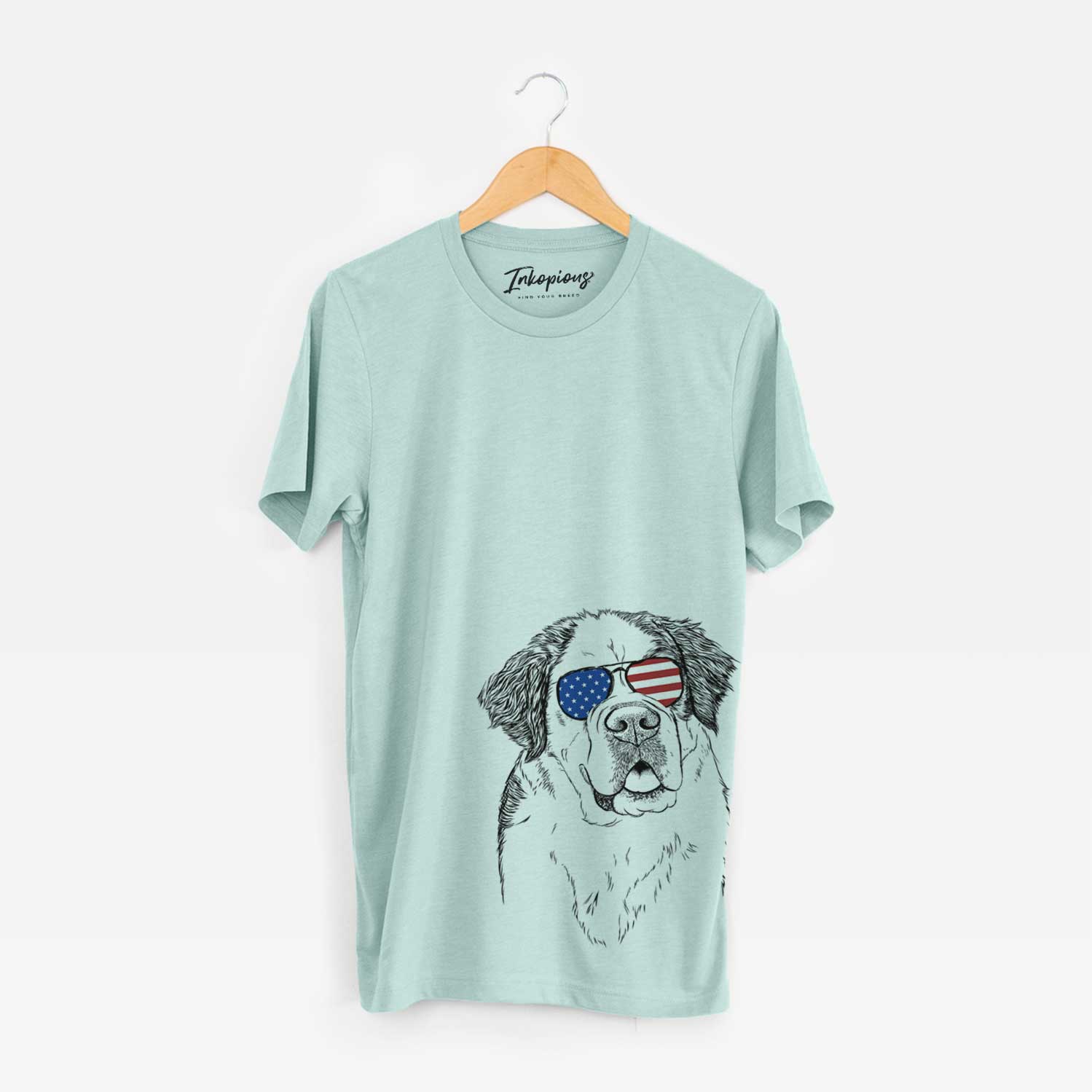 Hand-drawn sketch of Hook the Saint Bernard wearing American flag sunglasses on a Heather Sage Unisex crewneck