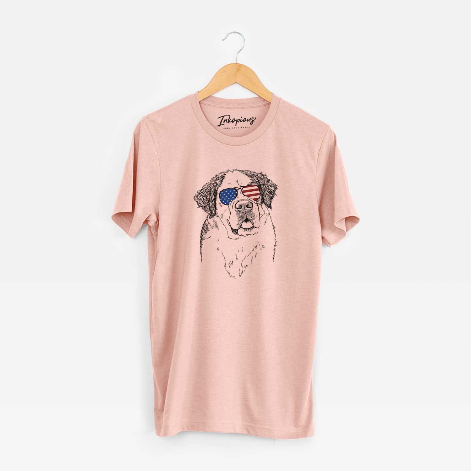 Hand-drawn sketch of Hook the Saint Bernard wearing American flag sunglasses on a Peach Unisex crewneck