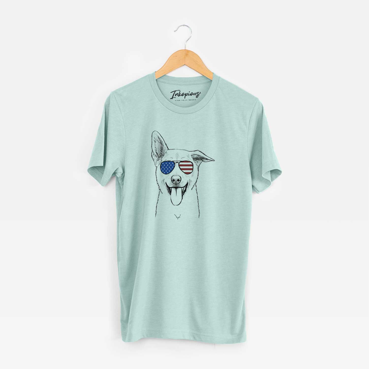 Hand-drawn sketch of Hoya the Korean Jindo wearing American flag sunglasses on a Heather Sage Unisex crewneck