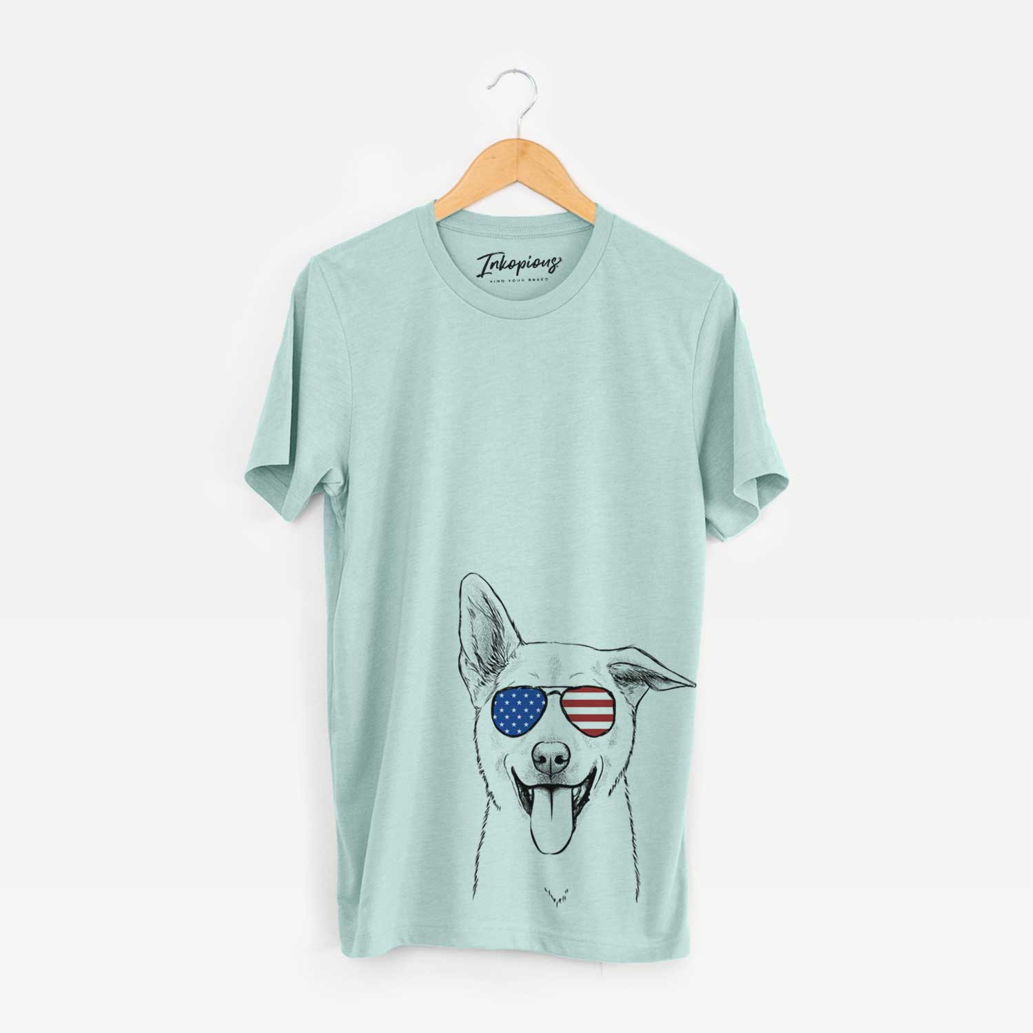 Hand-drawn sketch of Hoya the Korean Jindo wearing American flag sunglasses on a Heather Sage Unisex crewneck