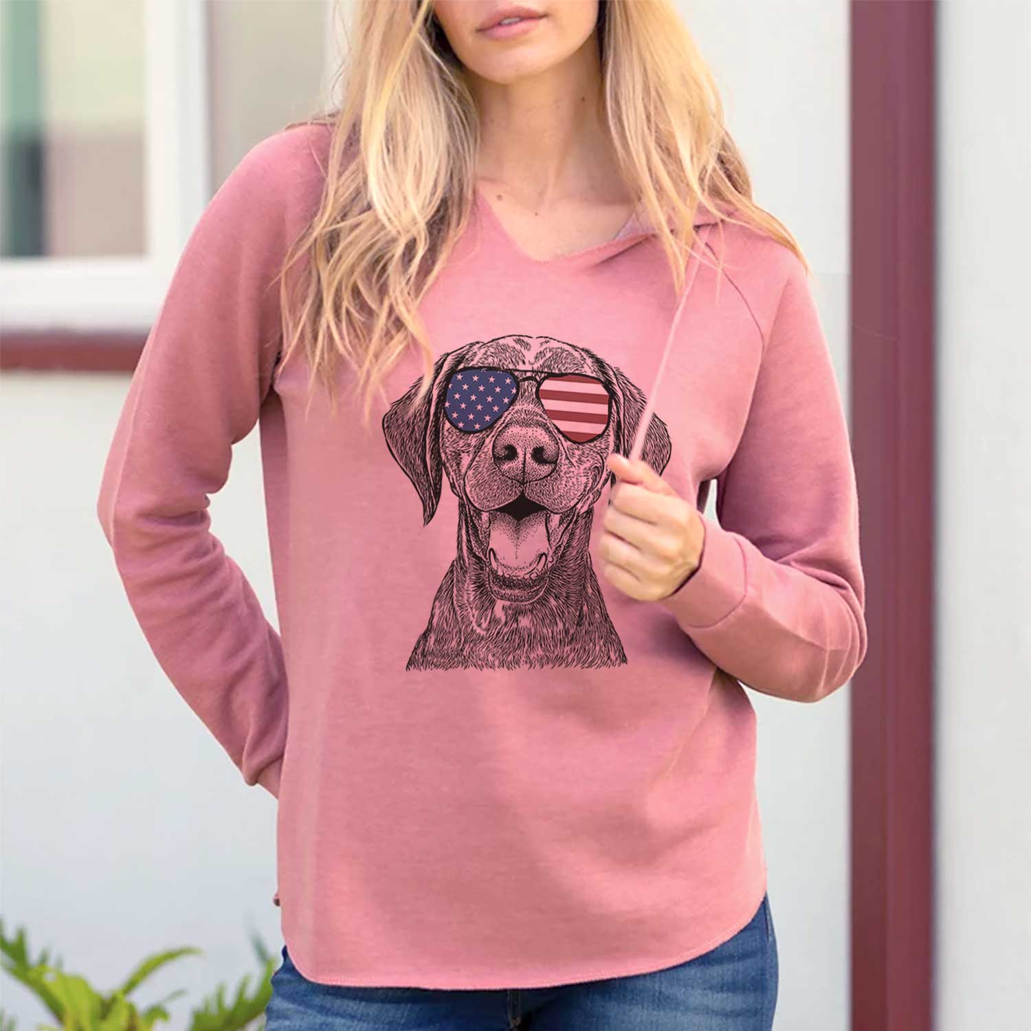 Hand-drawn sketch of Hudson the German Shorthaired Pointer wearing American flag sunglasses on a Dusty Rose Cali Wave Hooded Sweatshirt, lifestyle photo