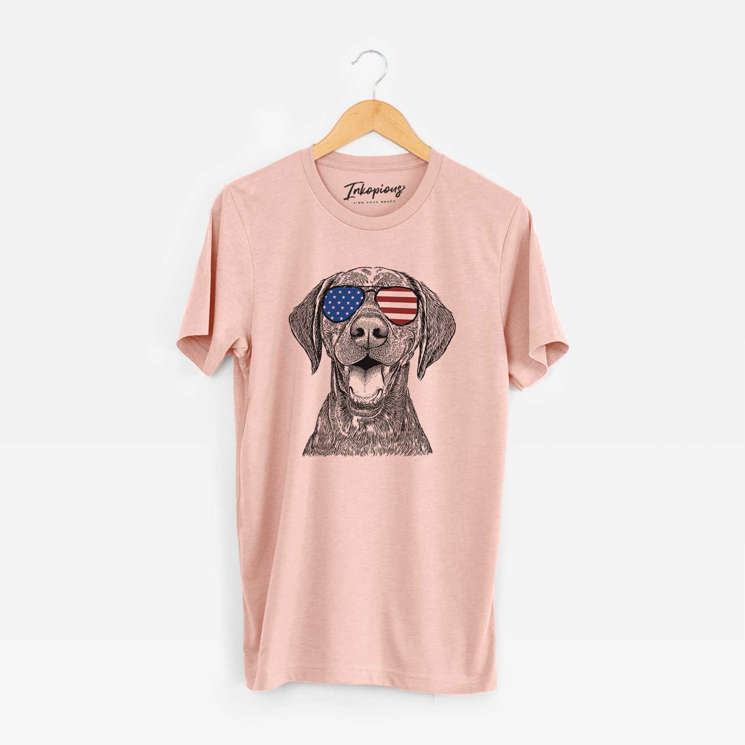 Hand-drawn sketch of Hudson the German Shorthaired Pointer wearing American flag sunglasses on a Peach Unisex crewneck