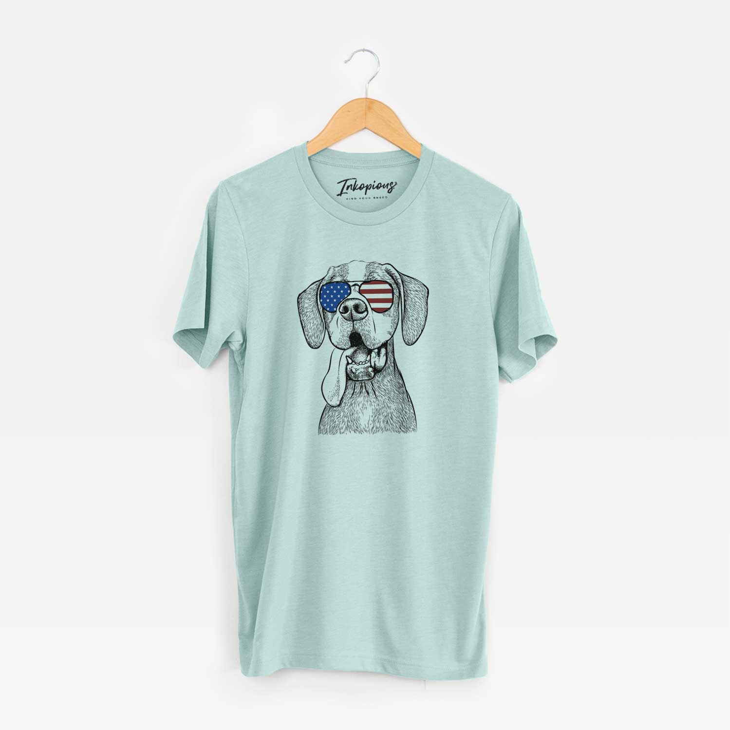 Hand-drawn sketch of Irwin the English Pointer wearing American flag sunglasses on a Heather Sage Unisex crewneck
