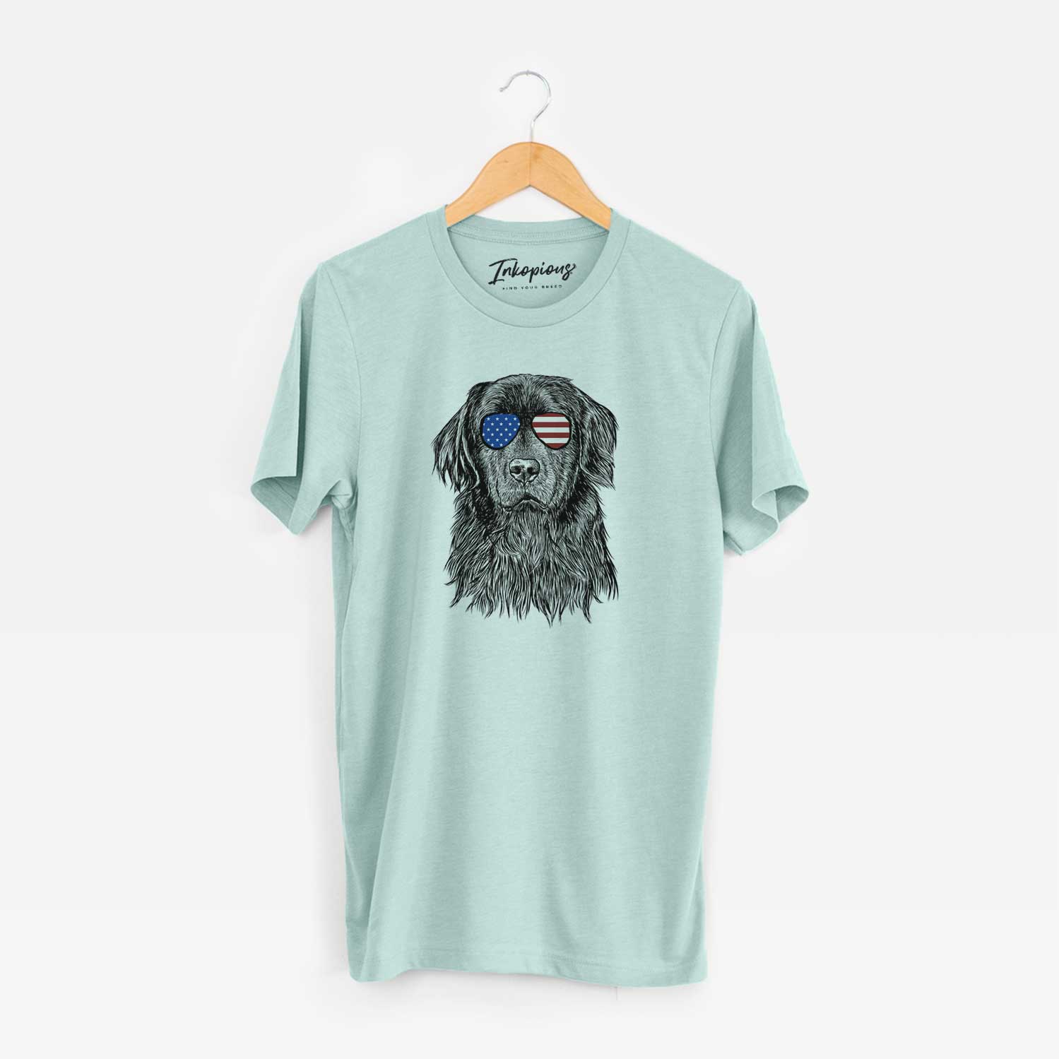 Hand-drawn sketch of Jinx the Newfoundland wearing American flag sunglasses on a Heather Sage Unisex crewneck