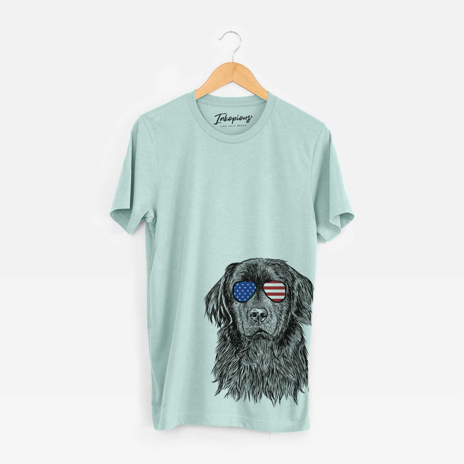 Hand-drawn sketch of Jinx the Newfoundland wearing American flag sunglasses on a Heather Sage Unisex crewneck