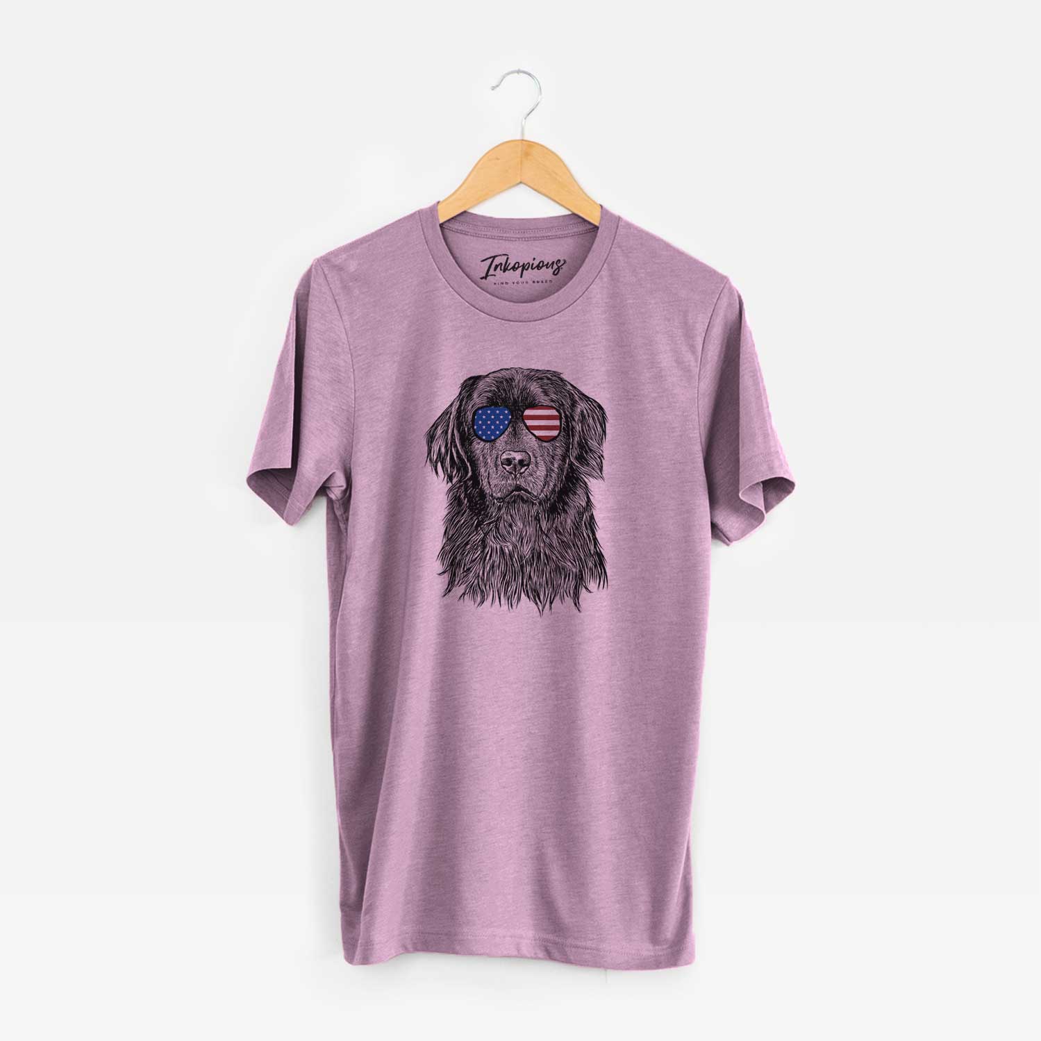 Hand-drawn sketch of Jinx the Newfoundland wearing American flag sunglasses on an Orchid Unisex crewneck
