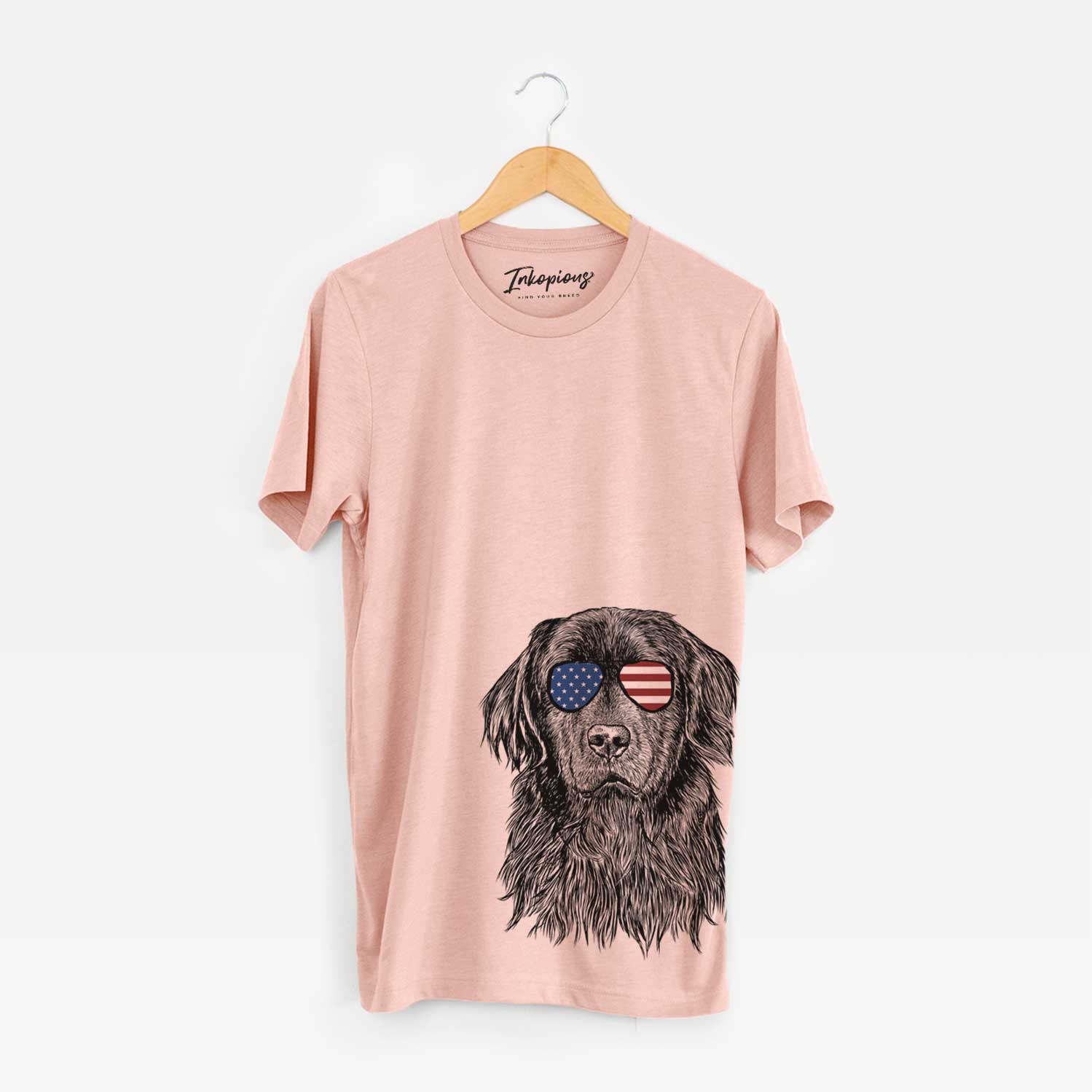 Hand-drawn sketch of Jinx the Newfoundland wearing American flag sunglasses on a Peach Unisex crewneck