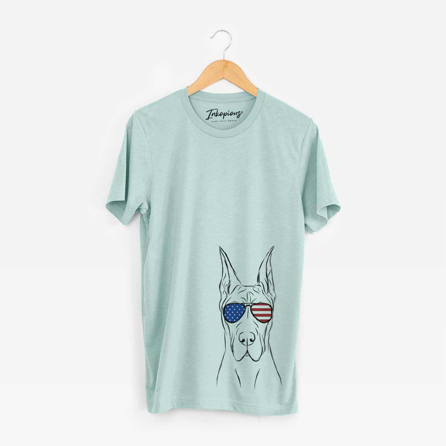 Hand-drawn sketch of Jude the Great Dane wearing American flag sunglasses on a Heather Sage Unisex crewneck