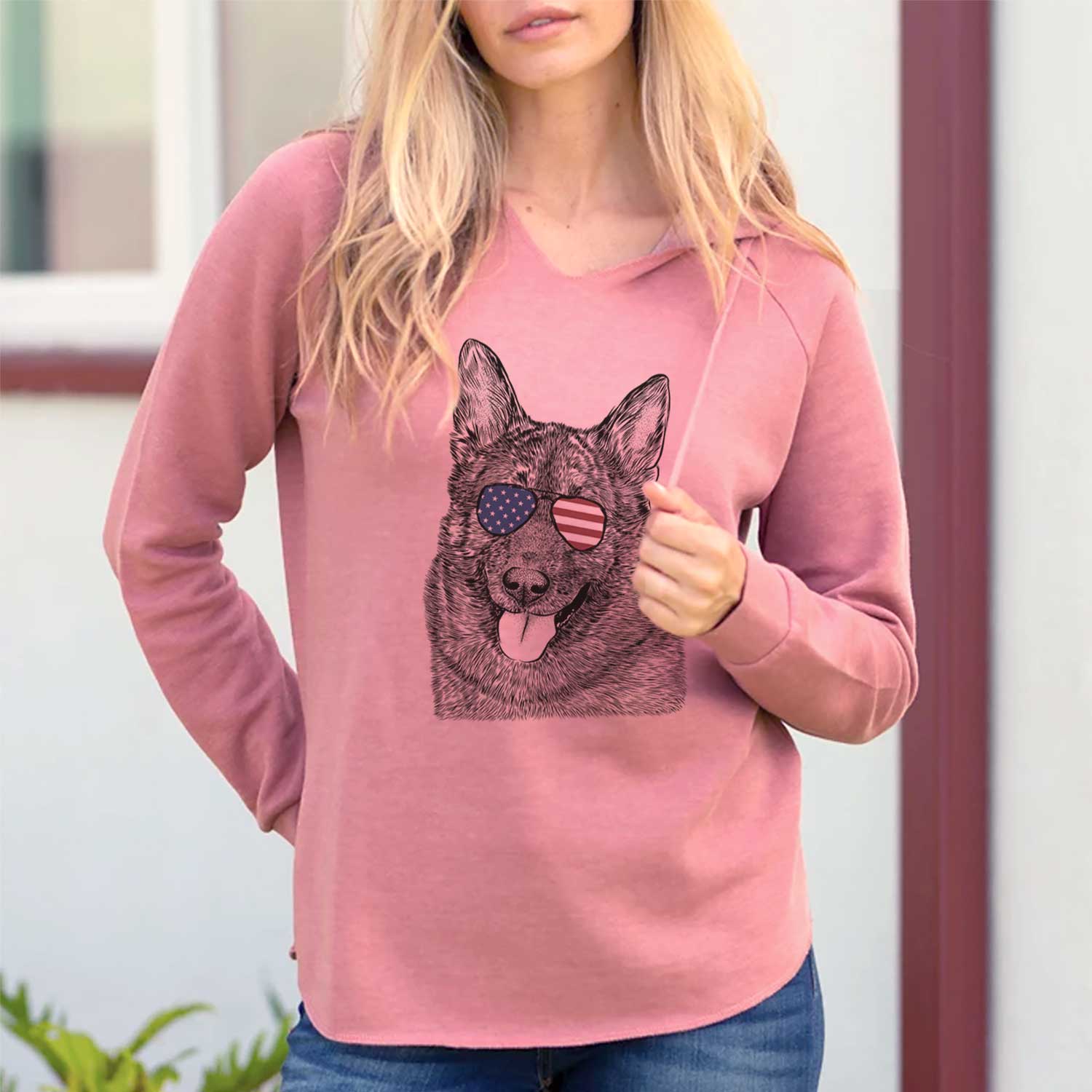 Hand-drawn sketch of Kasia the Norwegian Elkhound wearing American flag sunglasses on a Dusty Rose Cali Wave Hooded Sweatshirt, lifestyle photo