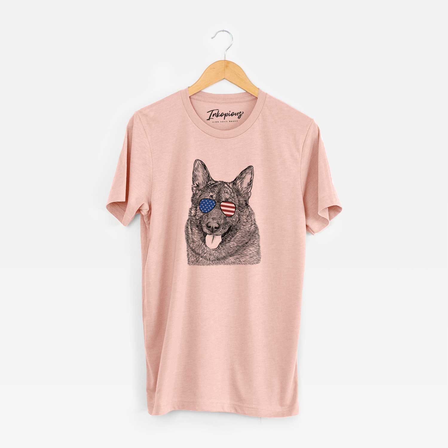 Hand-drawn sketch of Kasia the Norwegian Elkhound wearing American flag sunglasses on a Peach Unisex crewneck