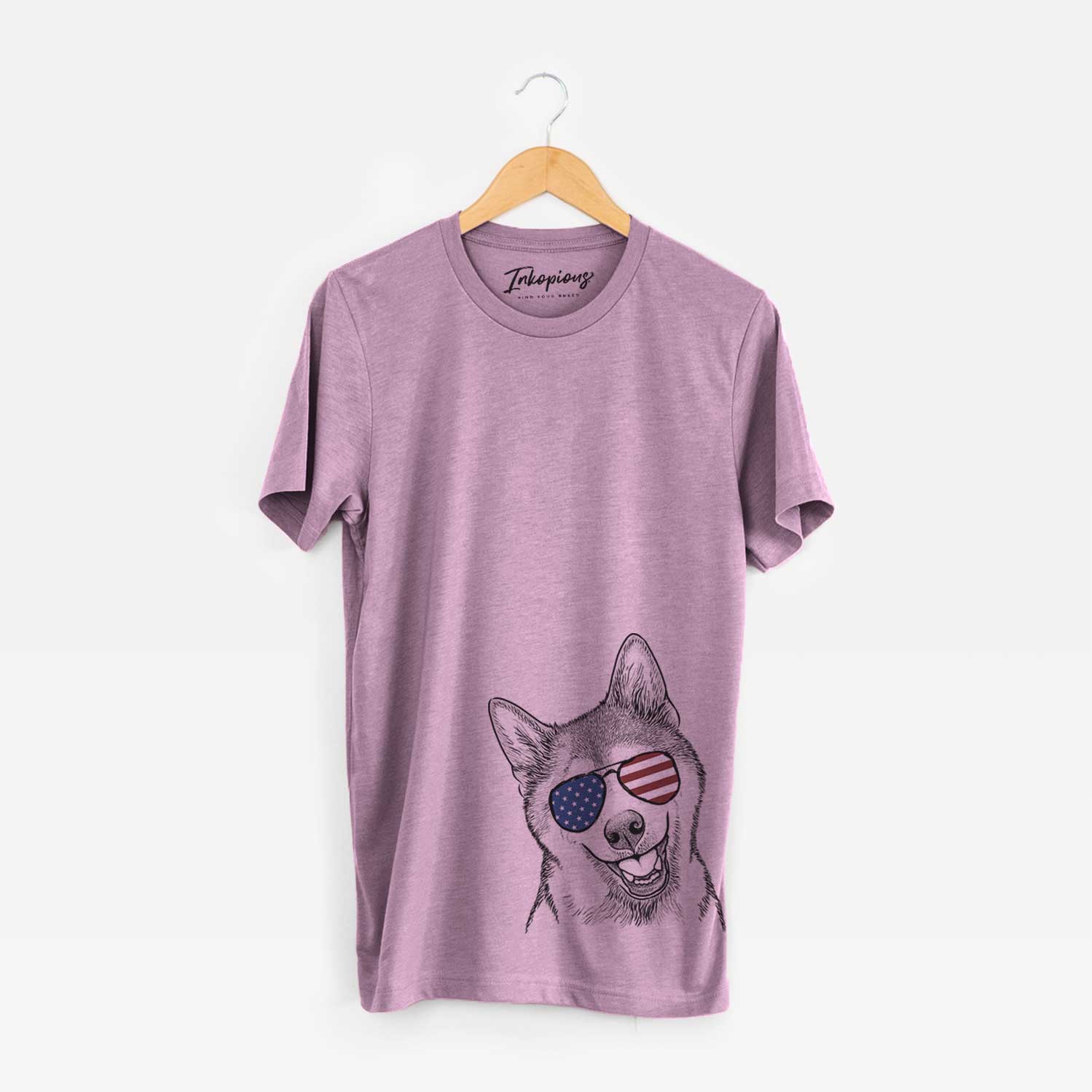 Hand-drawn sketch of Koby the Shiba Inu wearing American flag sunglasses on an Orchid Unisex crewneck