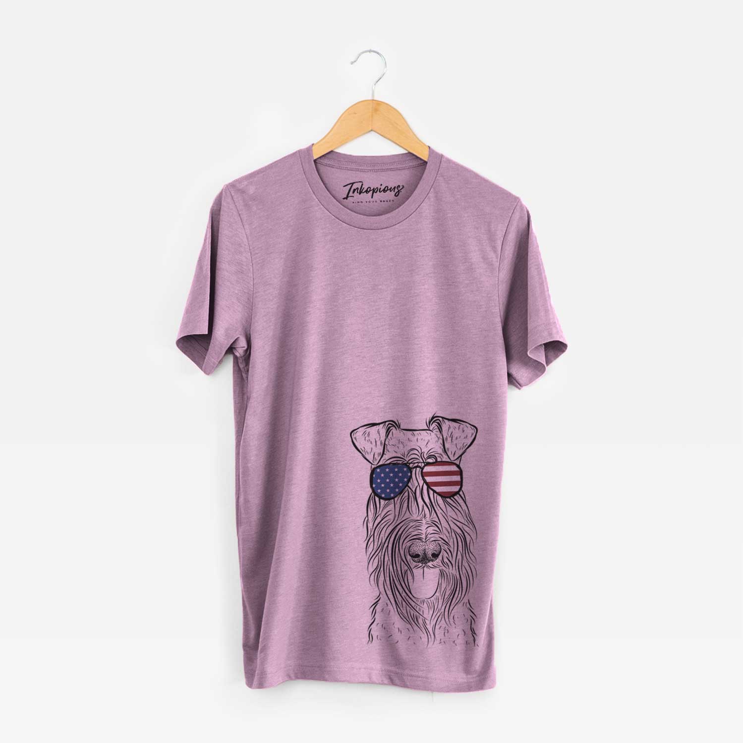 Hand-drawn sketch of Kricket the Kerry Blue Terrier wearing American flag sunglasses on an Orchid Unisex crewneck