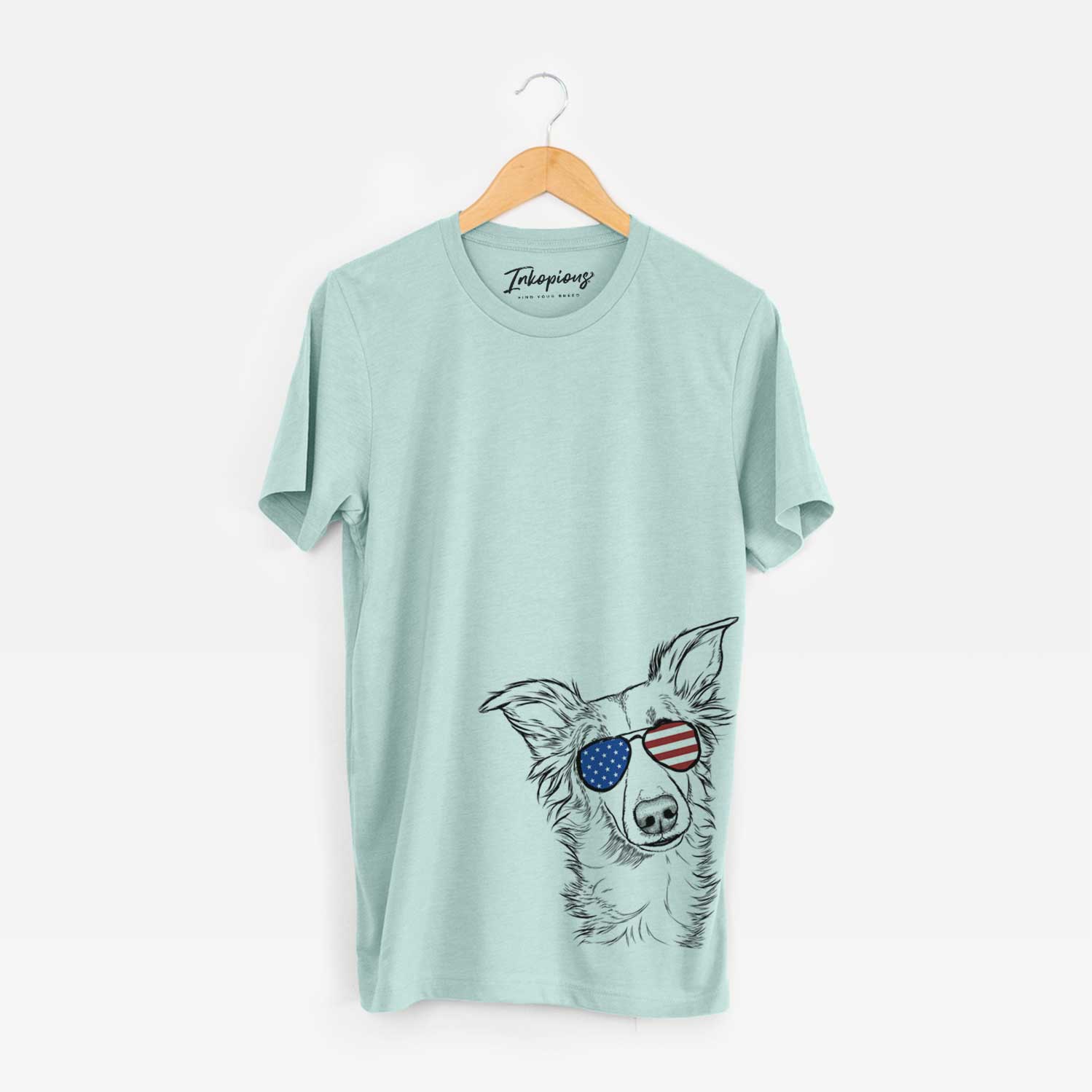 Hand-drawn sketch of Kyu the Windsprite wearing American flag sunglasses on a Heather Sage Unisex crewneck