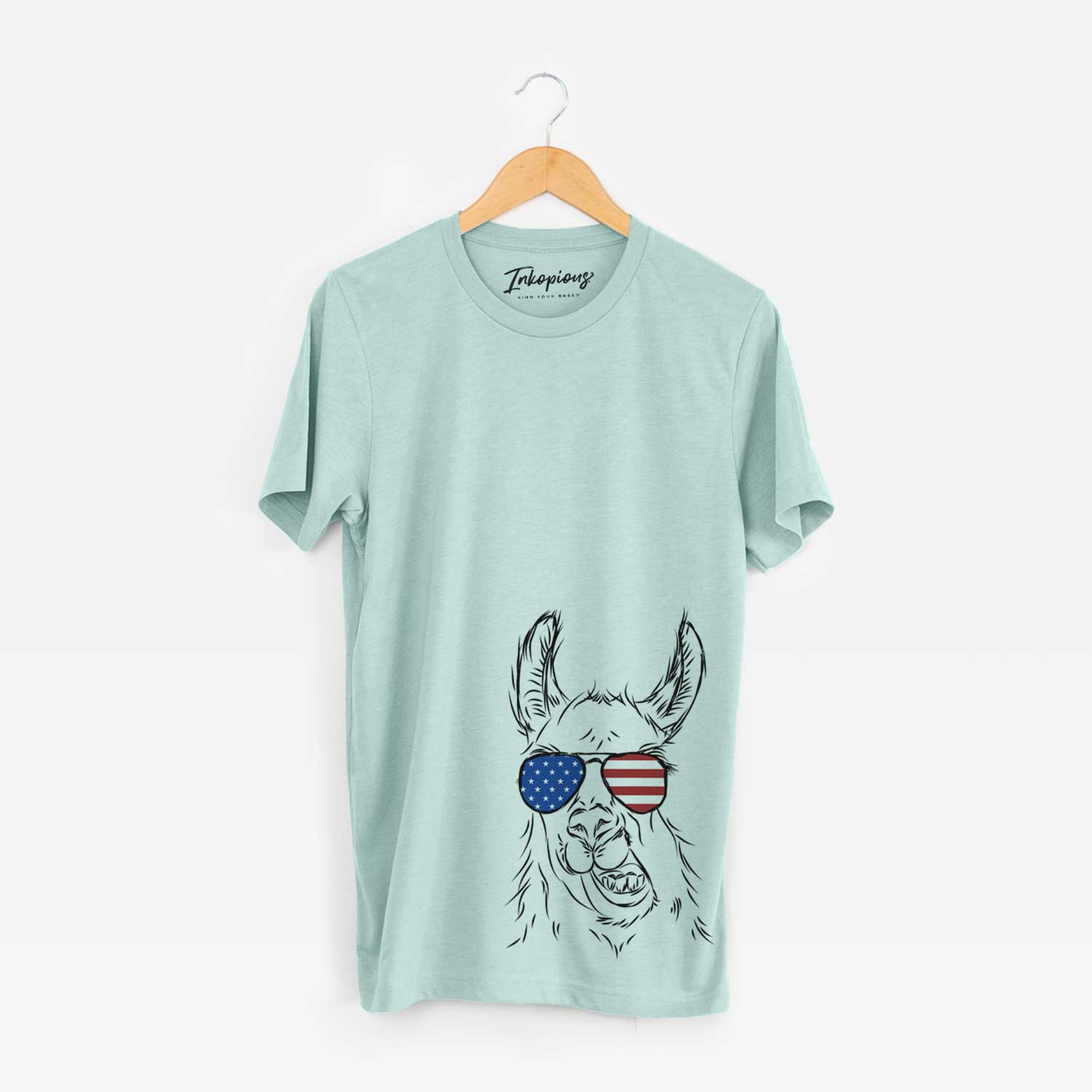 Hand-drawn sketch of Larry the Llama wearing American flag sunglasses on a Heather Sage Unisex crewneck