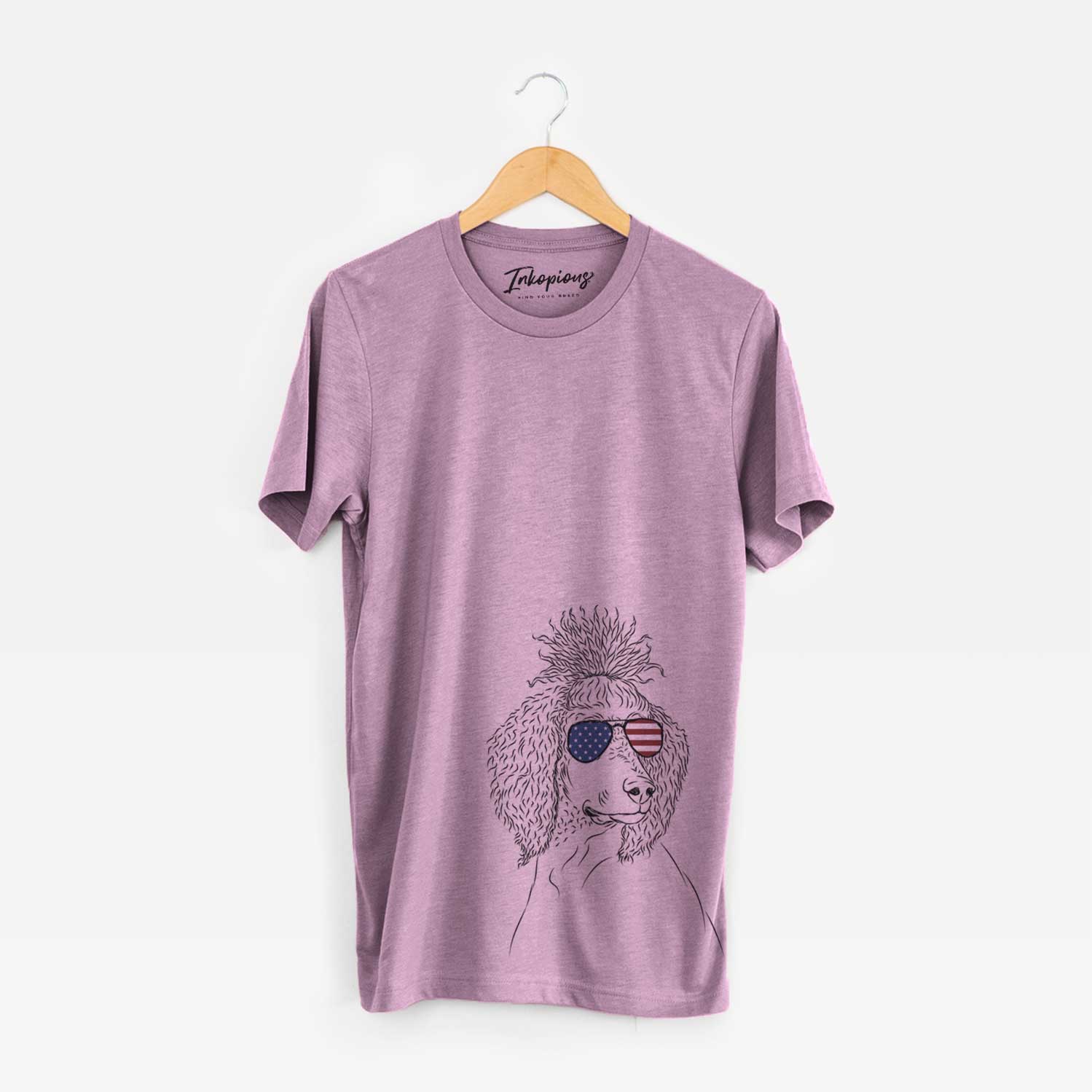 Hand-drawn sketch of Leo the Poodle wearing American flag sunglasses on an Orchid Unisex crewneck